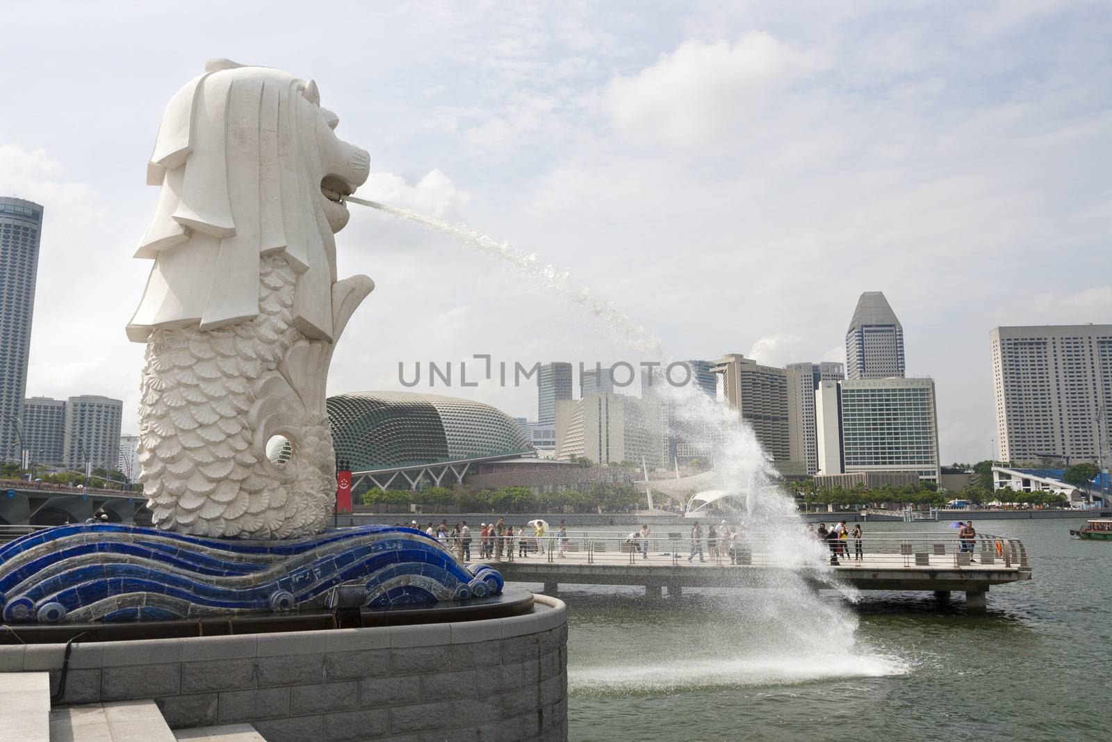 SINGAPORE - JUNE 16: Original Merlion statue fountain in Merlion Park, Singapore, June 16,2009. This fountain is one of most well known icons of Singapore & most important symbol, trademark of country