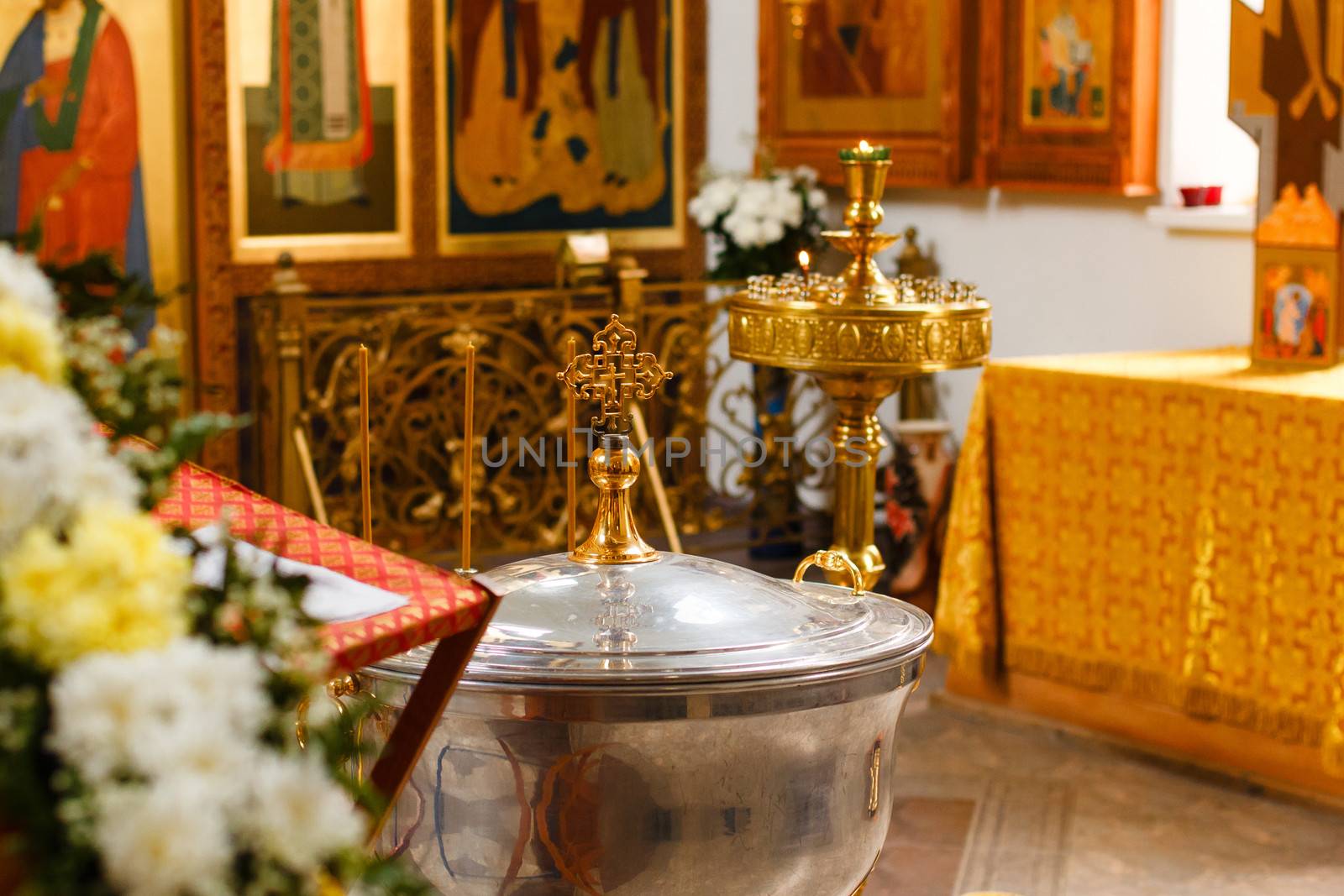 Orthodox Church and the interior, a cross and candles during worship