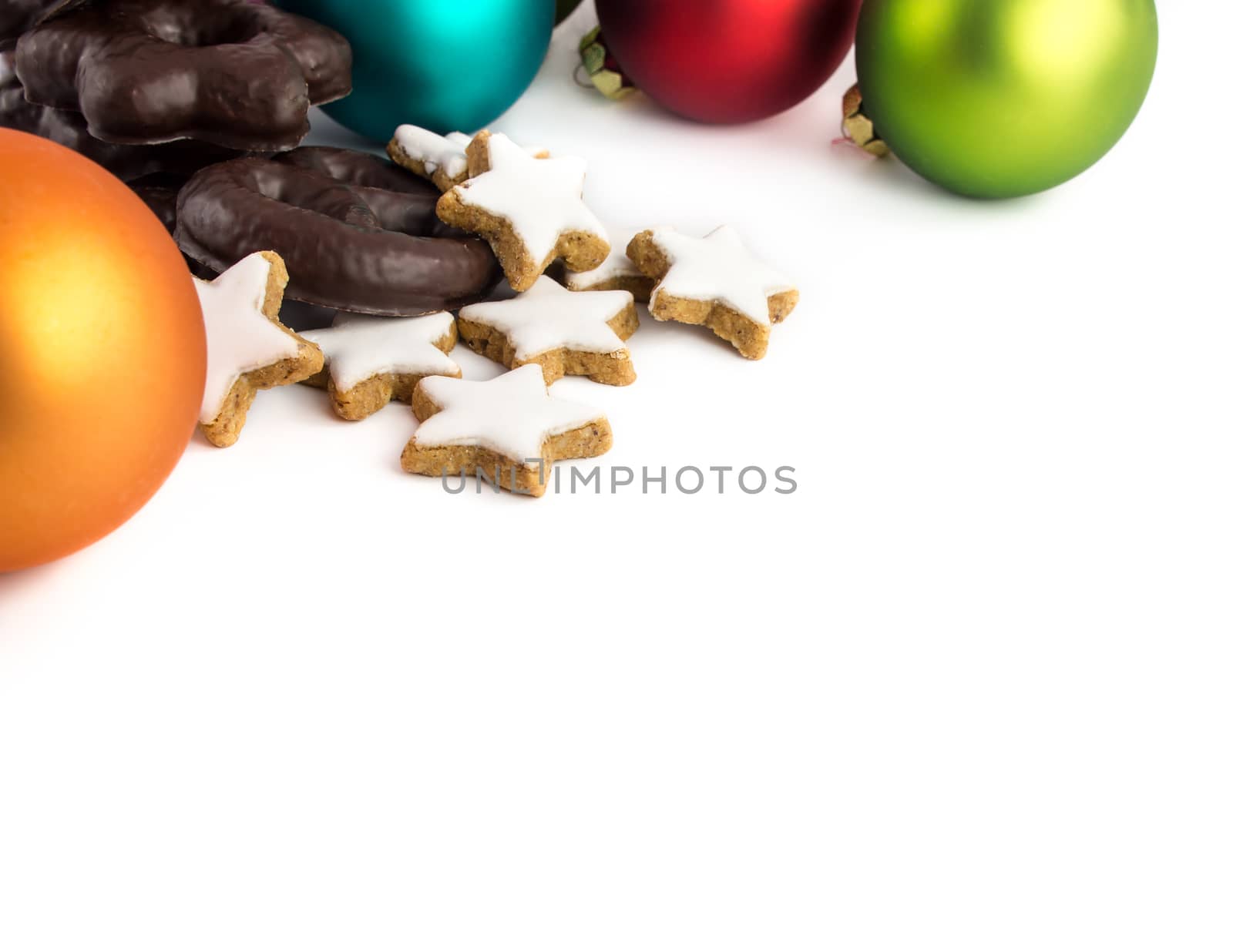 Black and white Christmas cookies - Gingerbread, cinnamon stars and colorful Christmas baubles