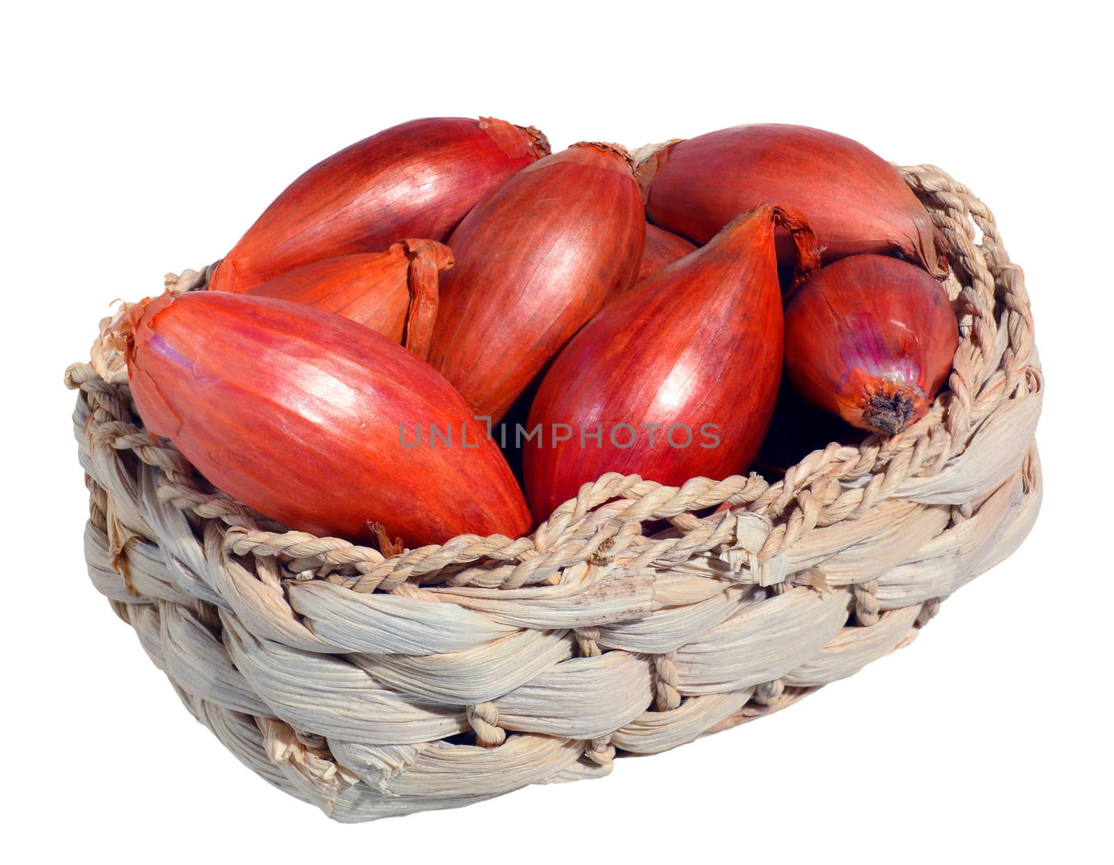 fresh shallots in a basket isolated in white