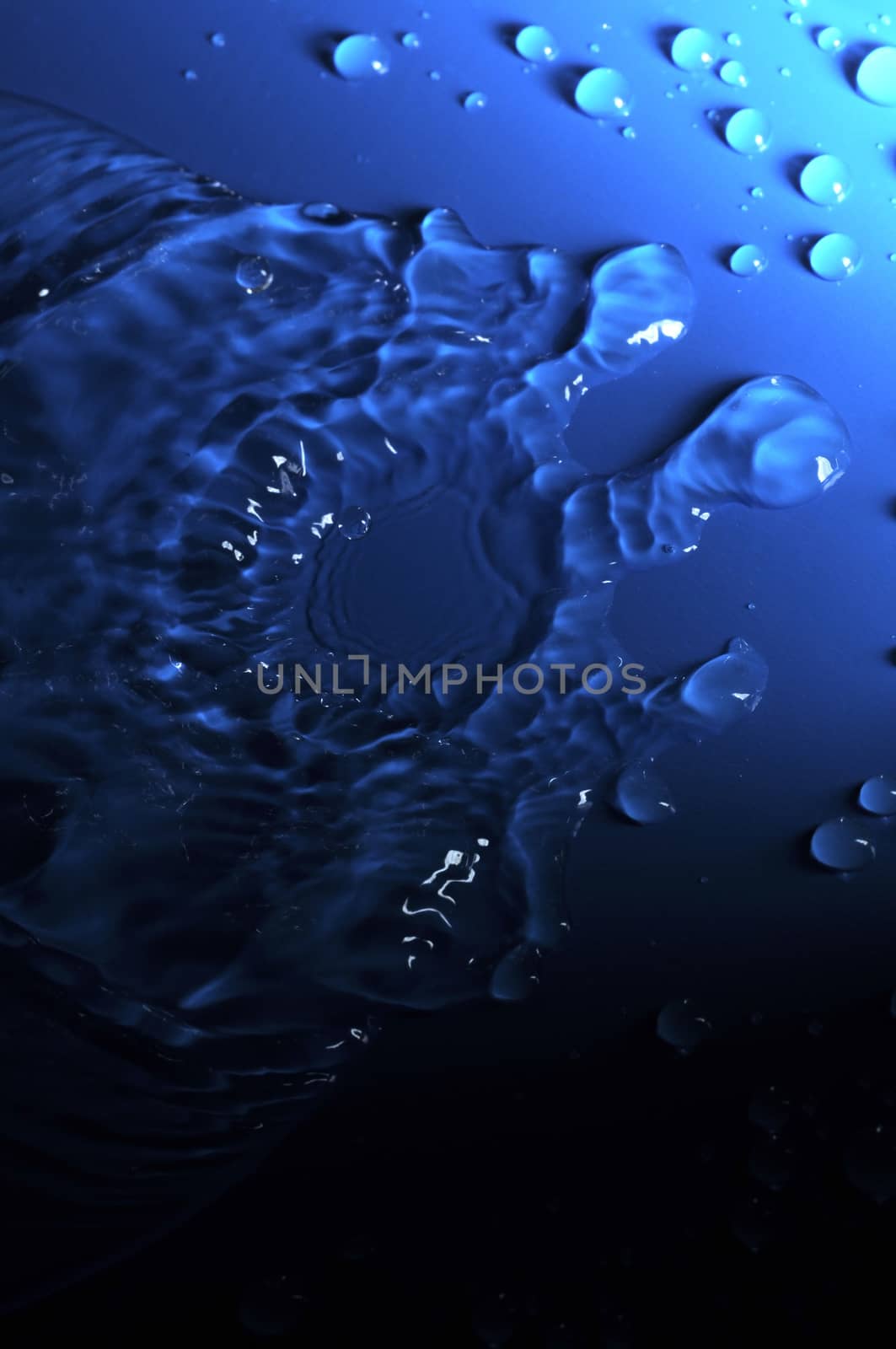 Some Water Drops on a Blue Textured Background