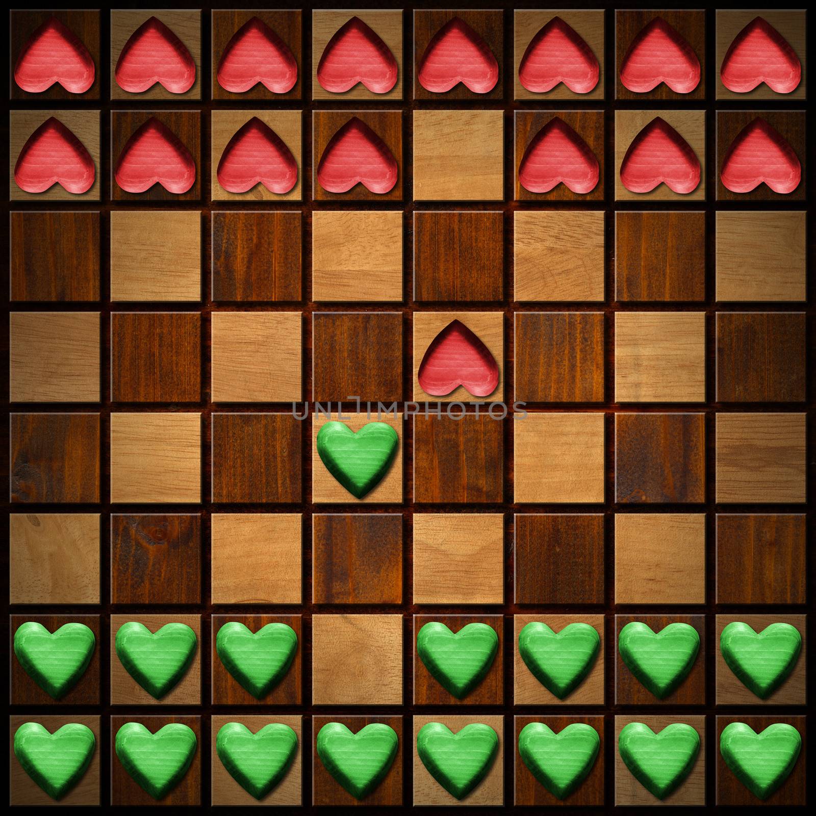 Wooden chessboard with wooden green and red hearts, love concept