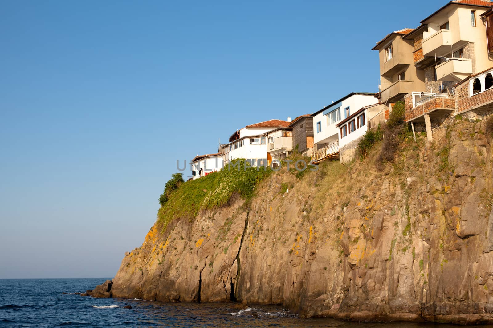 Houses on the cliff above the sea in Sozopol in Bulgaria
