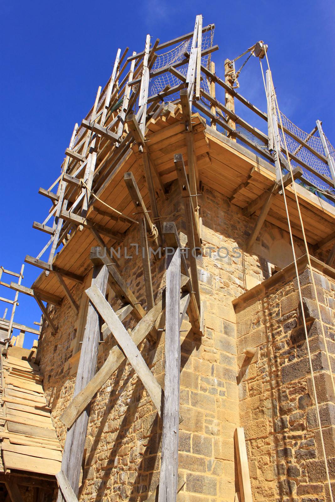 scaffolding for the construction and renovation of a medieval castle