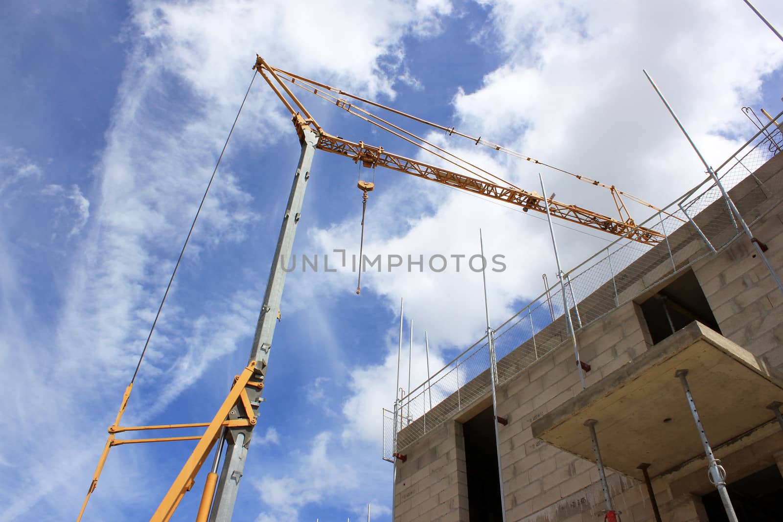 a crane at a construction site for the construction of residential housing