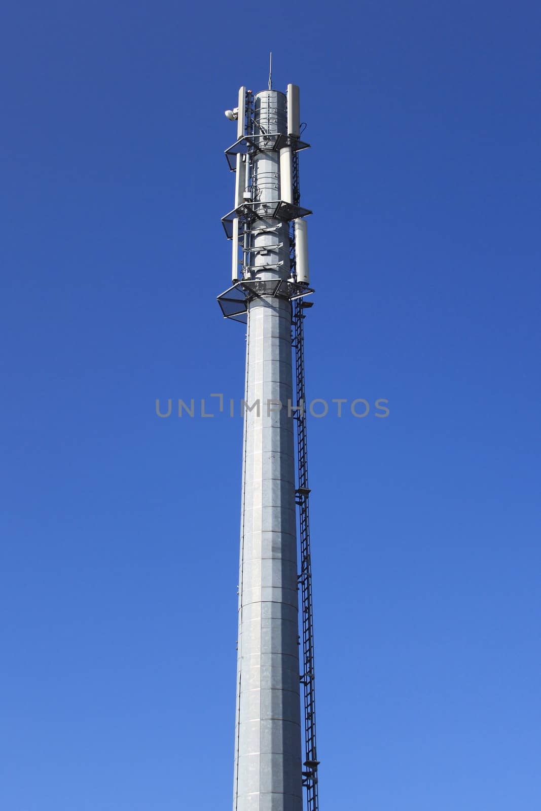 antenna or mobile phone masts and telecommunications on a blue sky