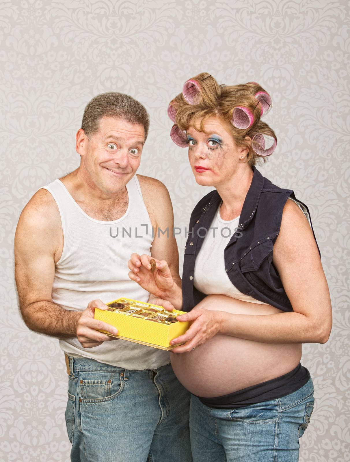 Smiling Man Feeding Pregnant Woman by Creatista