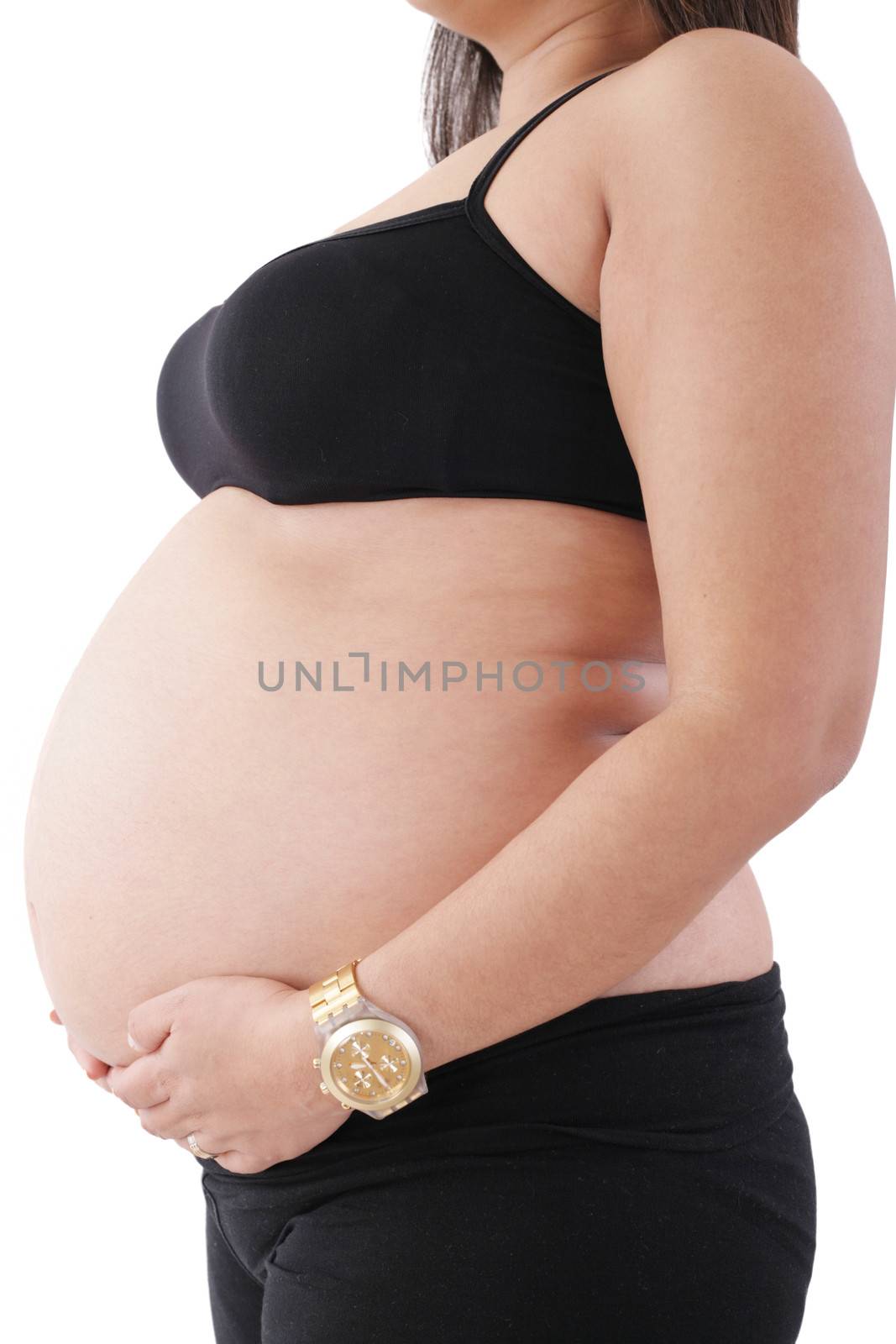 Image of pregnant woman touching her belly with hands by dacasdo