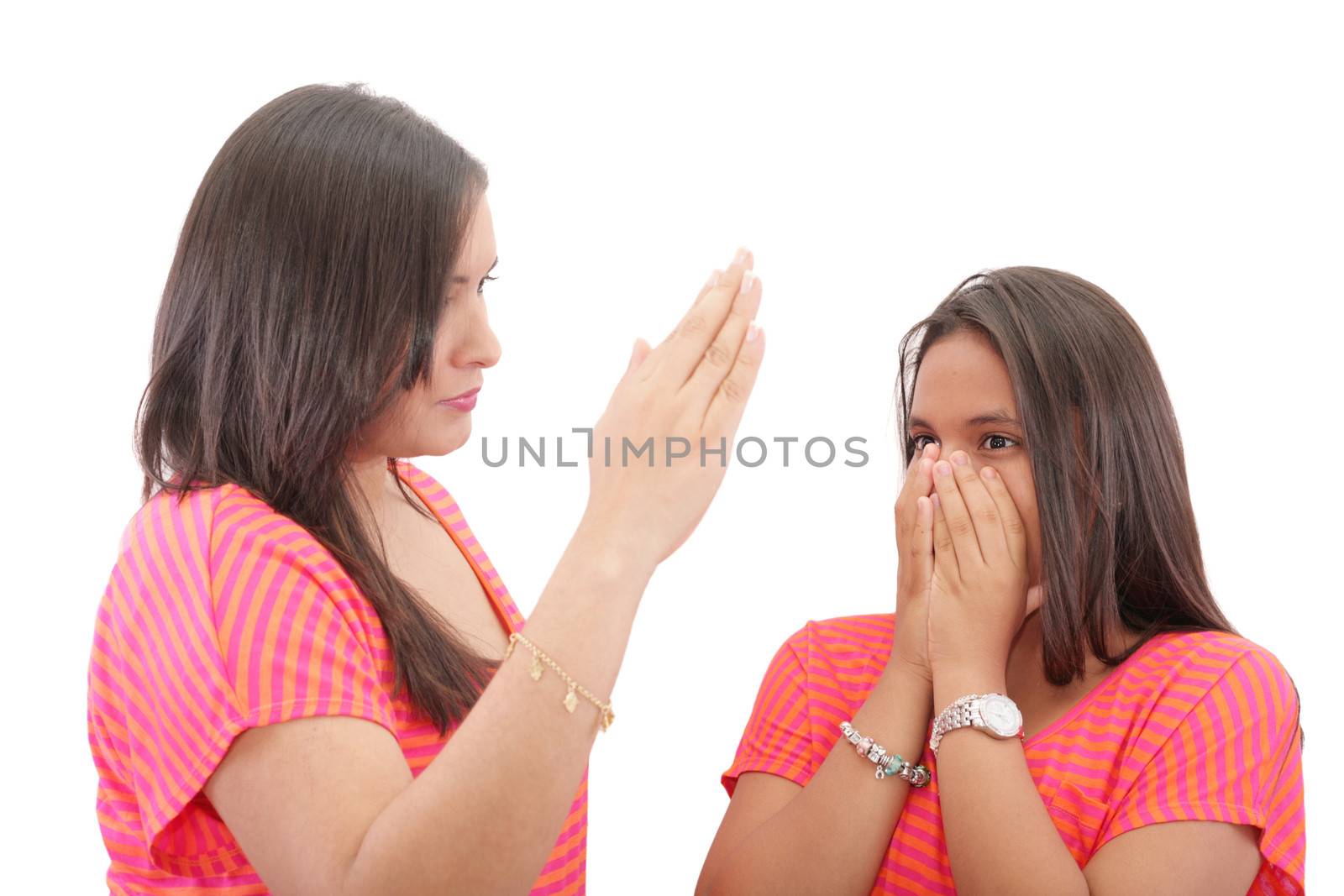 mother preparing to slap her daughter in the face