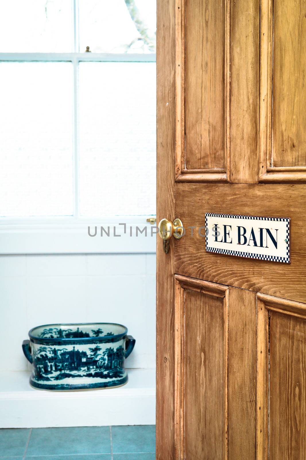 Bathroom door with French sign and vintage features