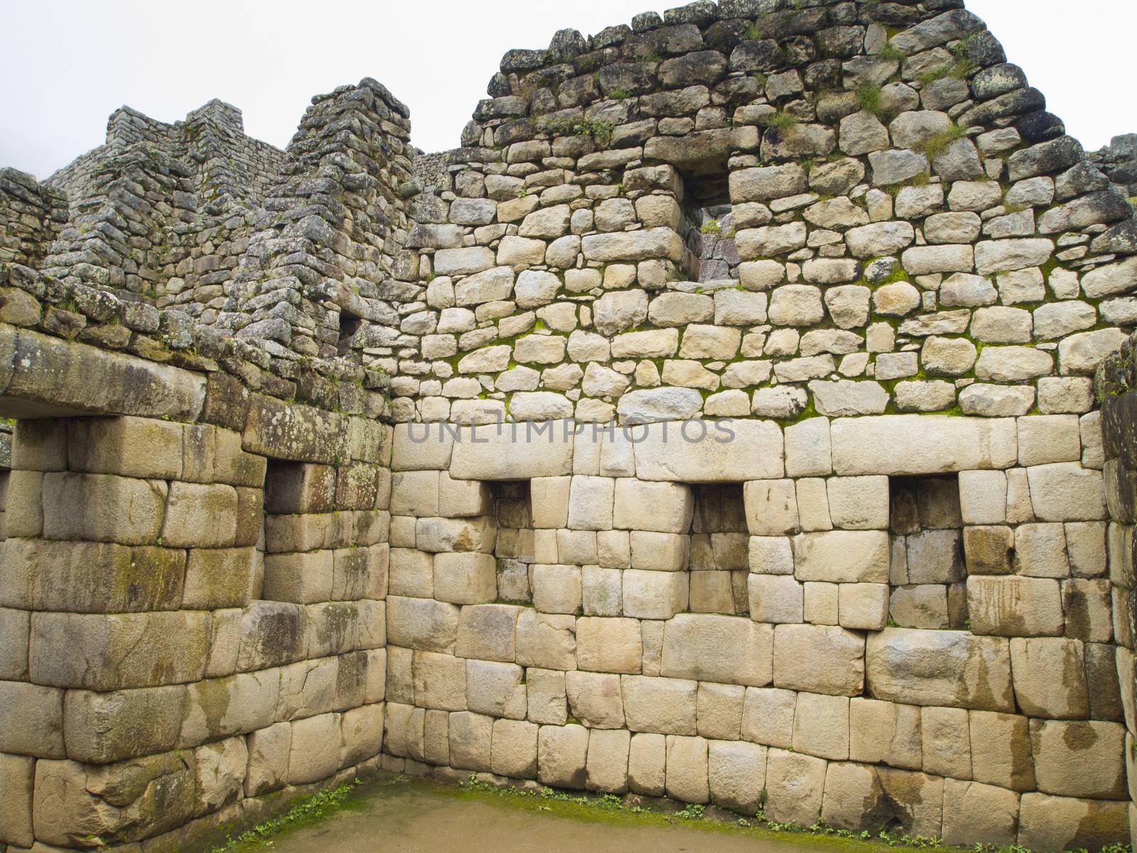 Made of Stone Interior in a room of Temple of the Sun in a pre-Columbian 15th-century Inca site of Machu Picchu in Cusco region, Peru.