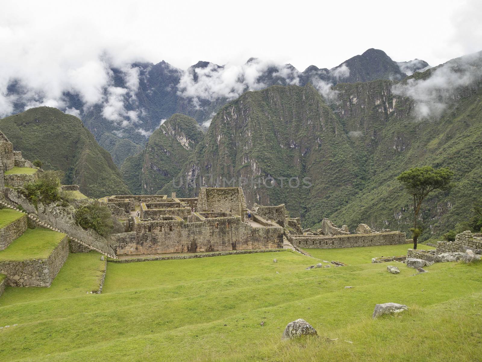 Ruins Buildings in Machu Picchu - Mysterious city and archaeological site of pre-Columbian civilization of the Incas on the Andes cordillera mountains archaeology near Cusco, Peru.