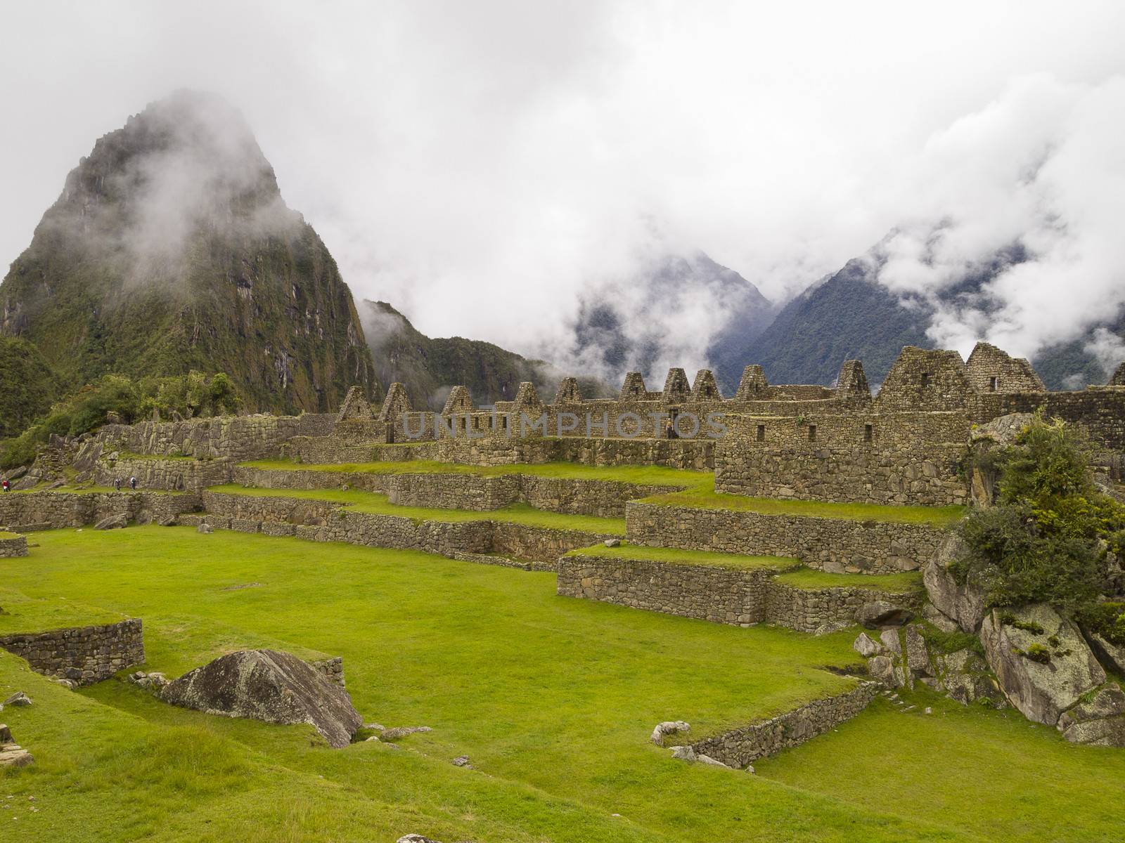 Ruins Buildings in Machu Picchu - Mysterious city and archaeological site of pre-Columbian civilization of the Incas on the Andes cordillera mountains archaeology near Cusco, Peru.