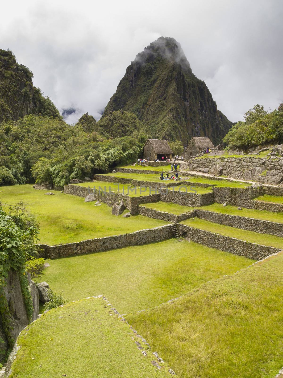 Ruins Buildings in Machu Picchu - Mysterious city and archaeological site of pre-Columbian civilization of the Incas on the Andes cordillera mountains archaeology near Cusco, Peru.