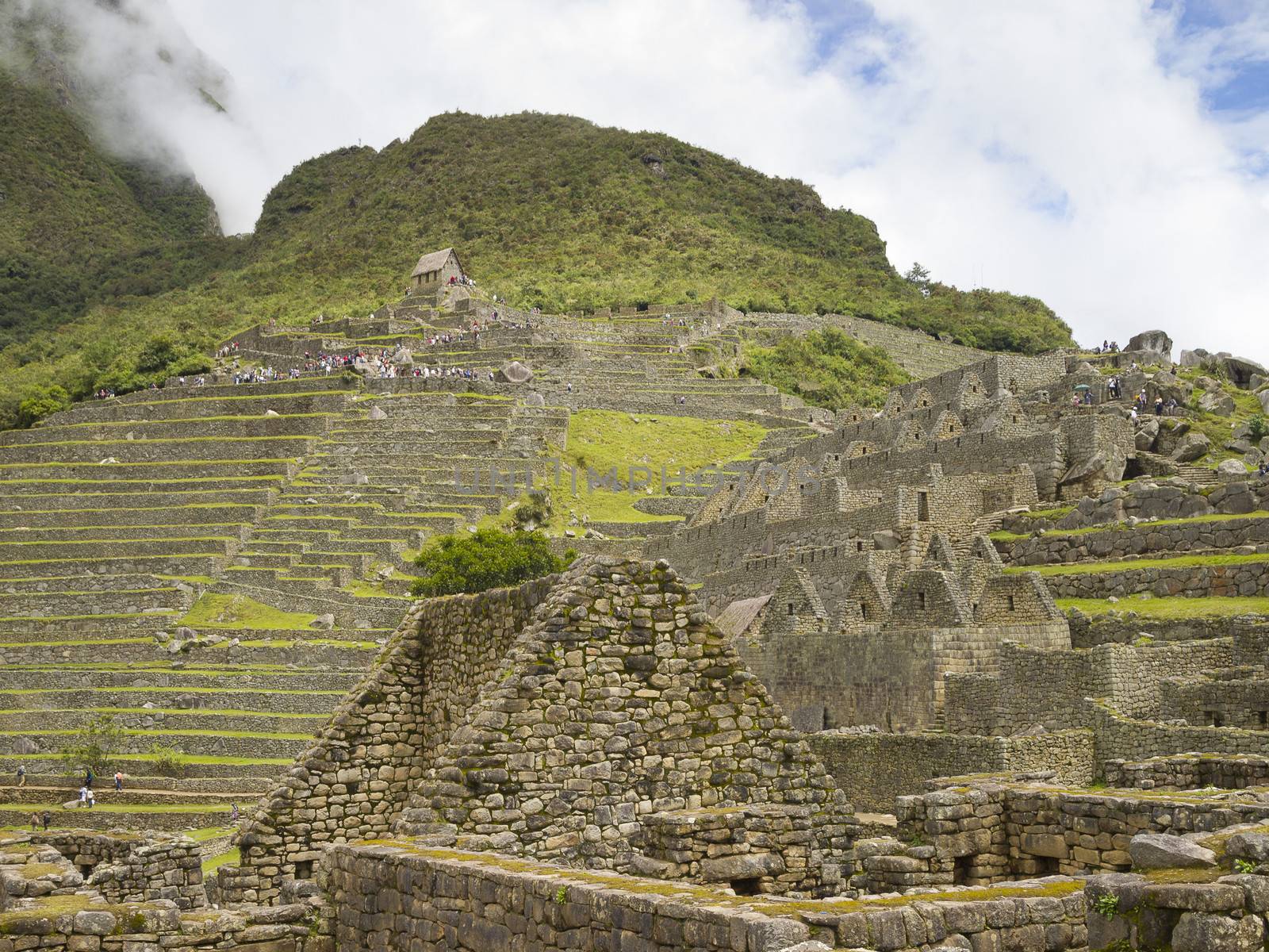 The Watchman's Hut on the top of Terraced Fields in the upper Agricultural Sector in a pre-Columbian 15th-century Inca site of the lost Inca city Machu Picchu, Andes mountains, Urubamba, Cusco, Peru.