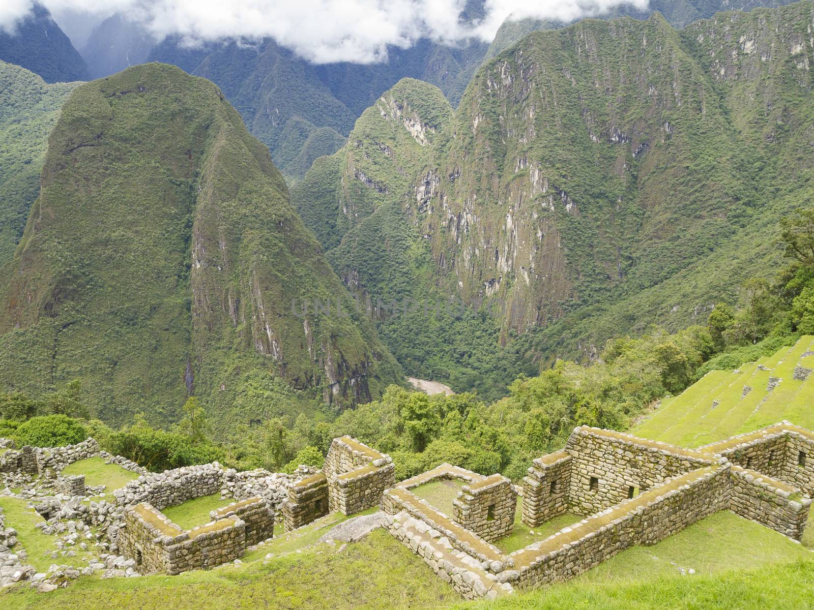 View from The Sun Temple in a pre-Columbian 15th-century Inca site of Machu Picchu in Machupicchu District, Urubamba Province, Cusco Region, Peru.