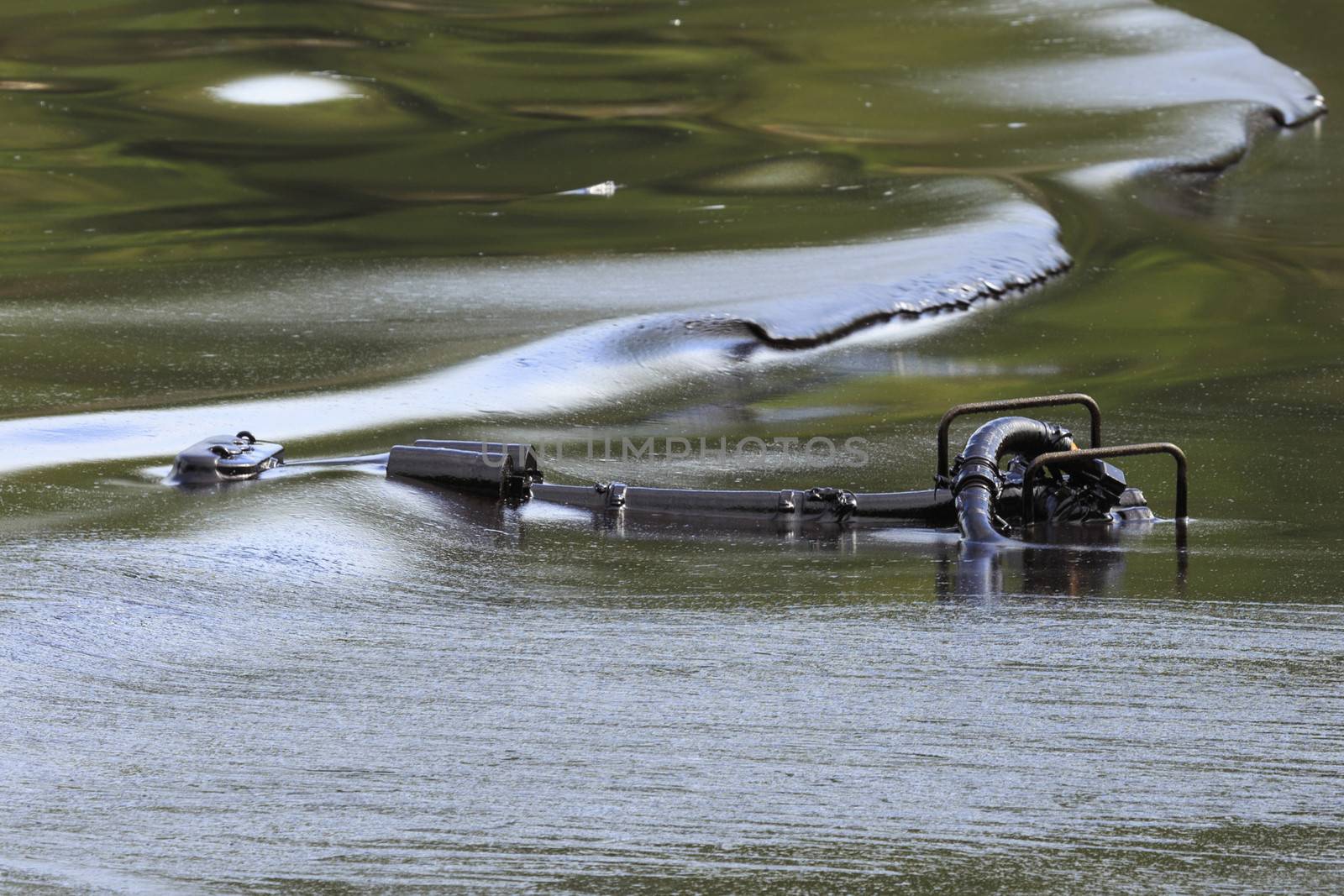 Oil pump soaked in crude oil spilled on the beach of Thailand