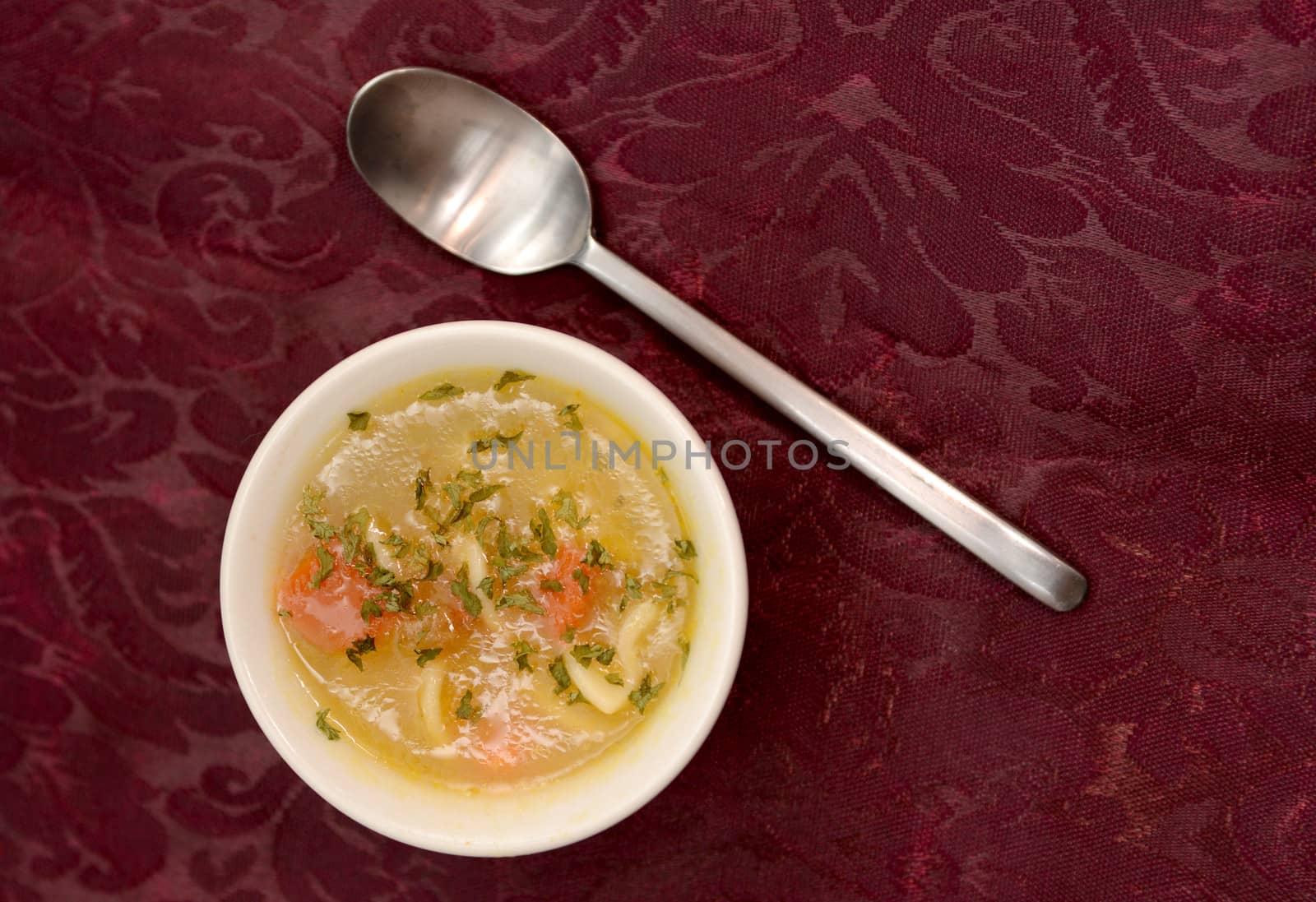 vegetable soup on decorative table cloth