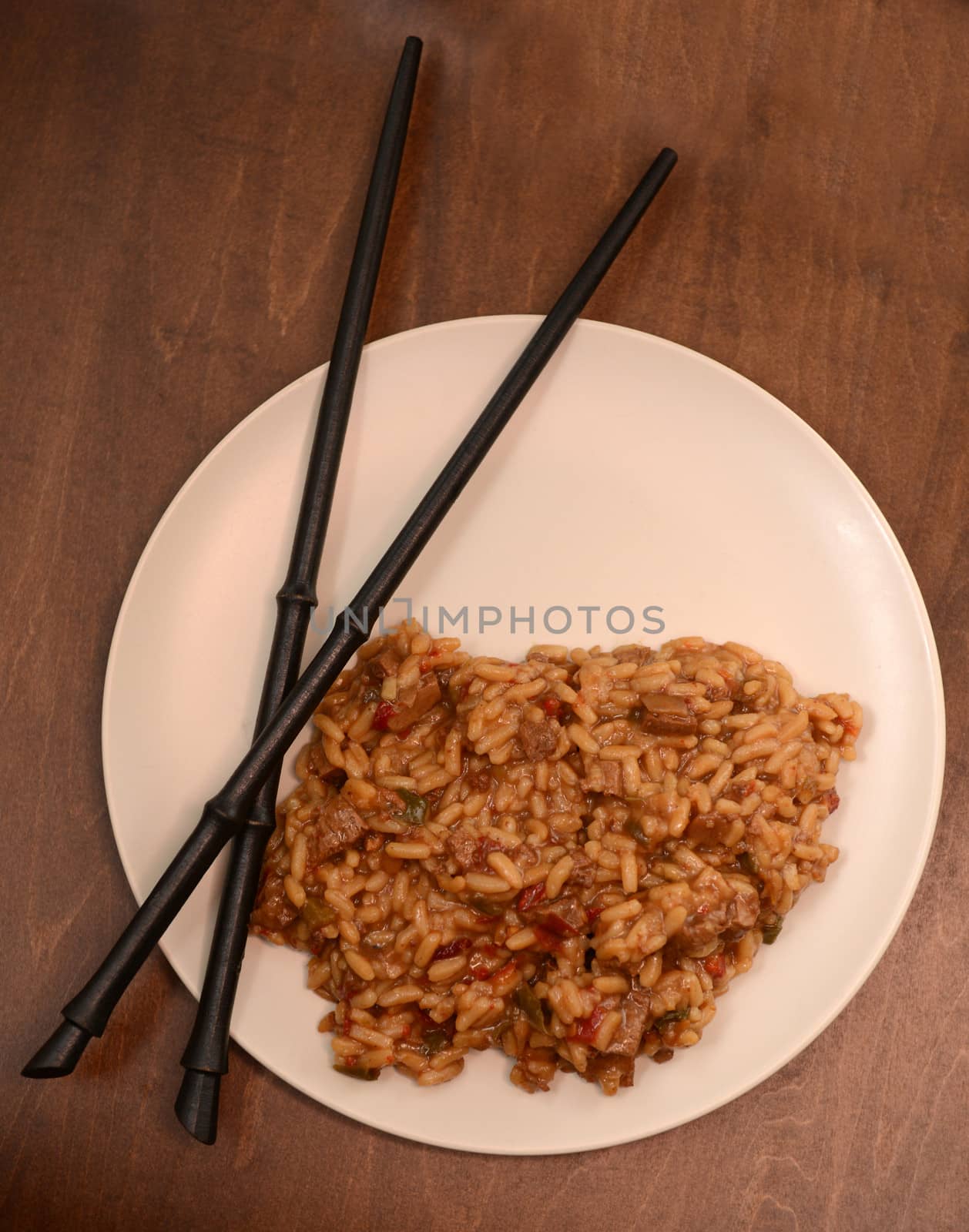 rice dish with chopsticks on wood table