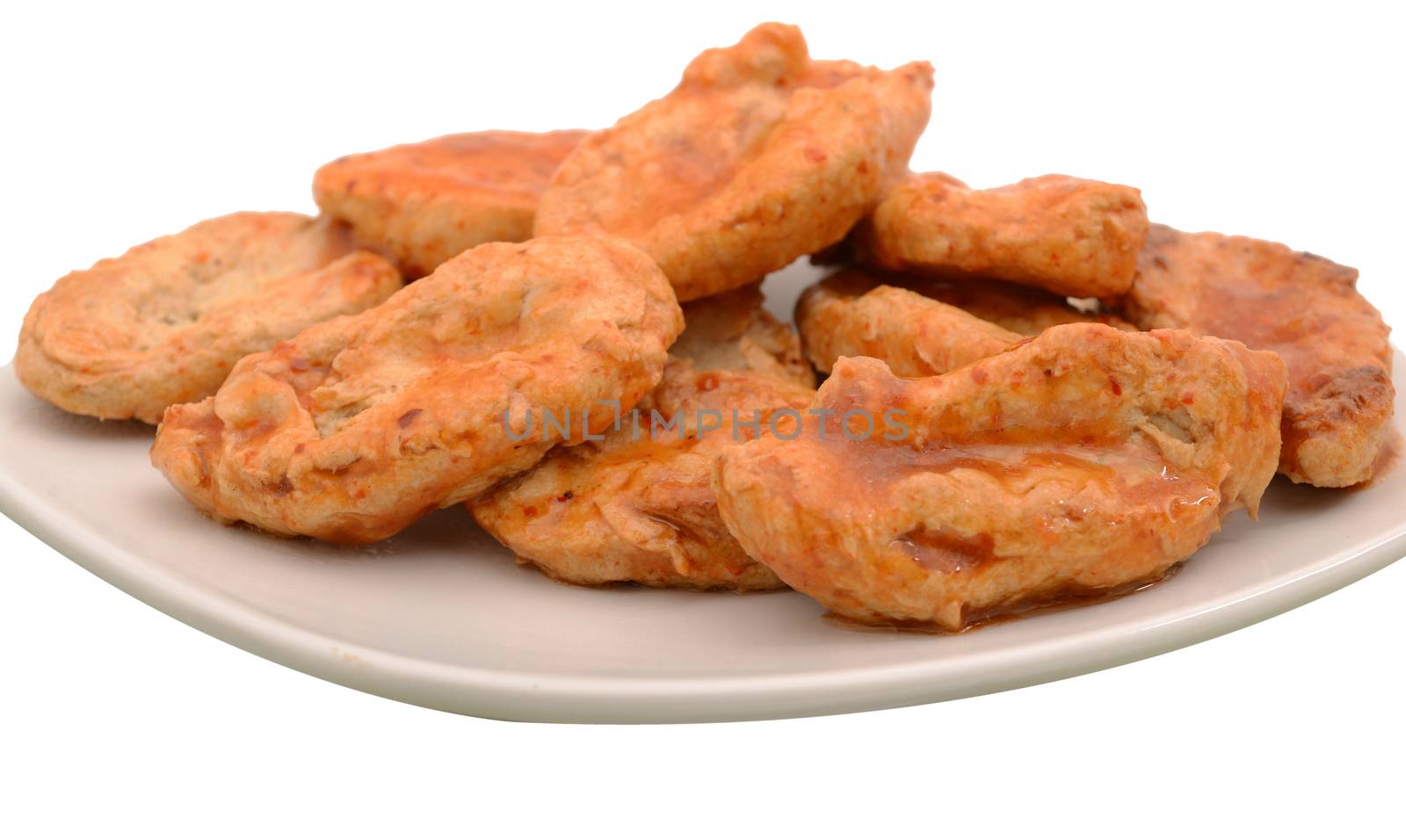 spicy chicken on white plate and isolated on white background