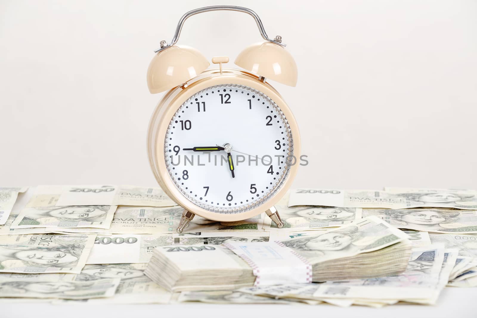 time is money business concept with czech banknotes crown