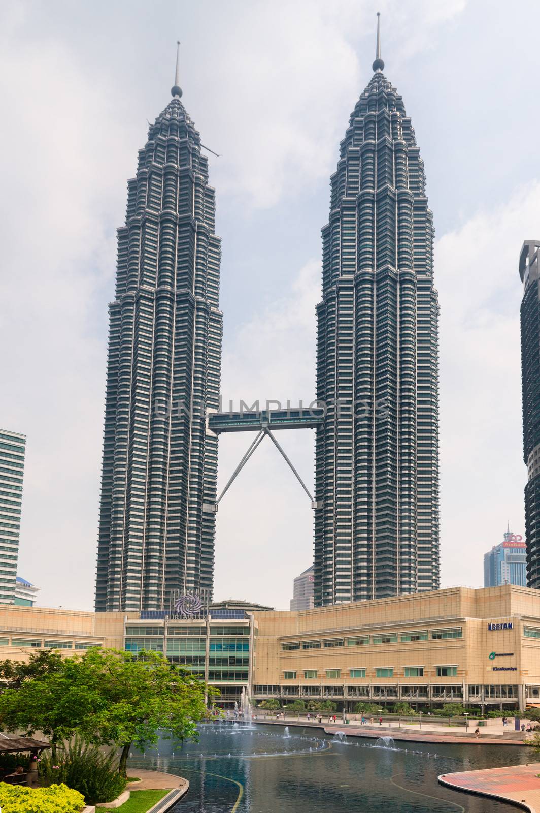 Petronas Towers and Symphony lake in Kuala Lumpur by iryna_rasko