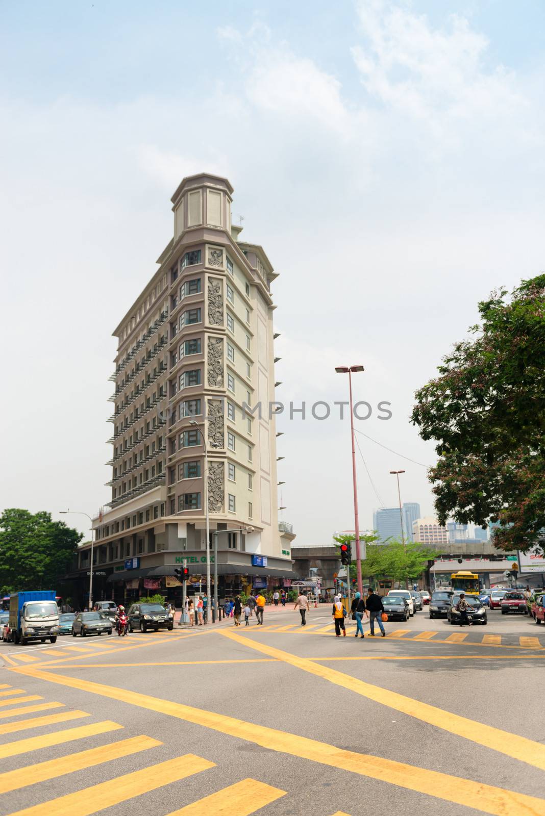 KUALA LUMPUR - JUN 15: Big crossroads in Chinatown on Jun 15, 2013 in Kuala Lumpur, Malaysia. The city architecture is a blend of colonial, Asian, Malay Islamic, modern mix. 