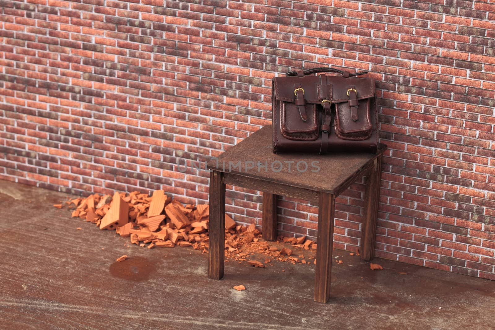 abandoned bag on a brick wall on a table