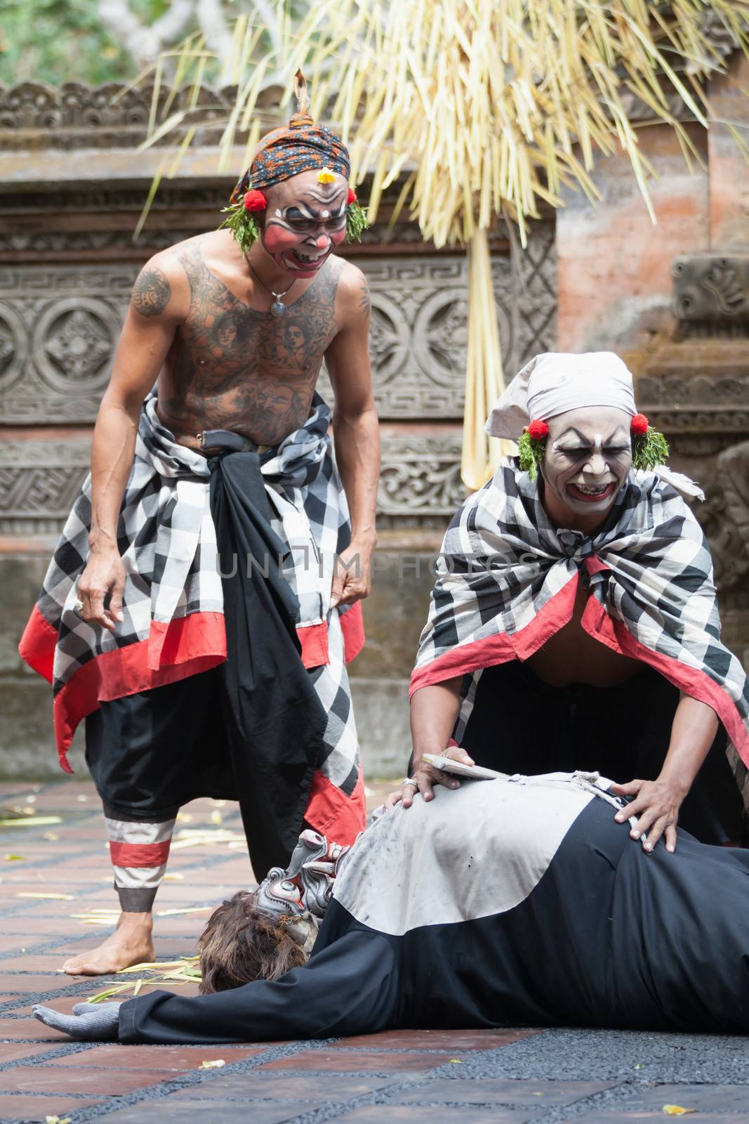 BALI - SEP 21: Clown Barong and Kris Dance performs at Sahadewah, in Batubulan, Bali, Indonesia on Sep 21, 2012. This famous play represents an fight between good and bad gods.