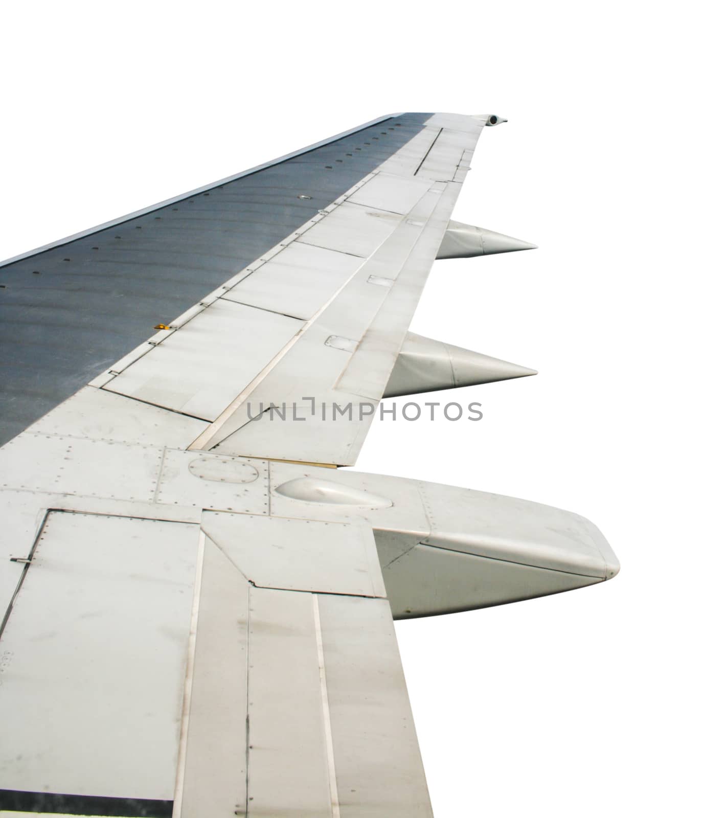 Wing of airplane flying on white background