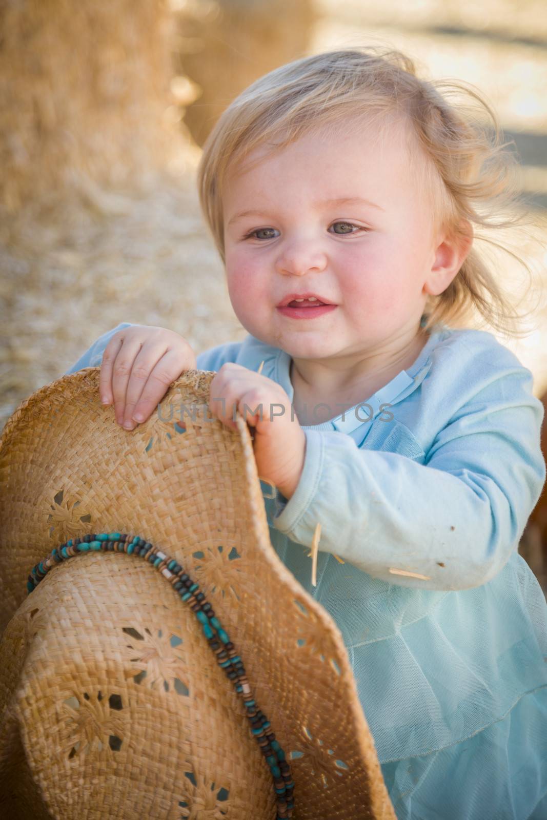 Adorable Baby Girl with Cowboy Hat at the Pumpkin Patch
 by Feverpitched