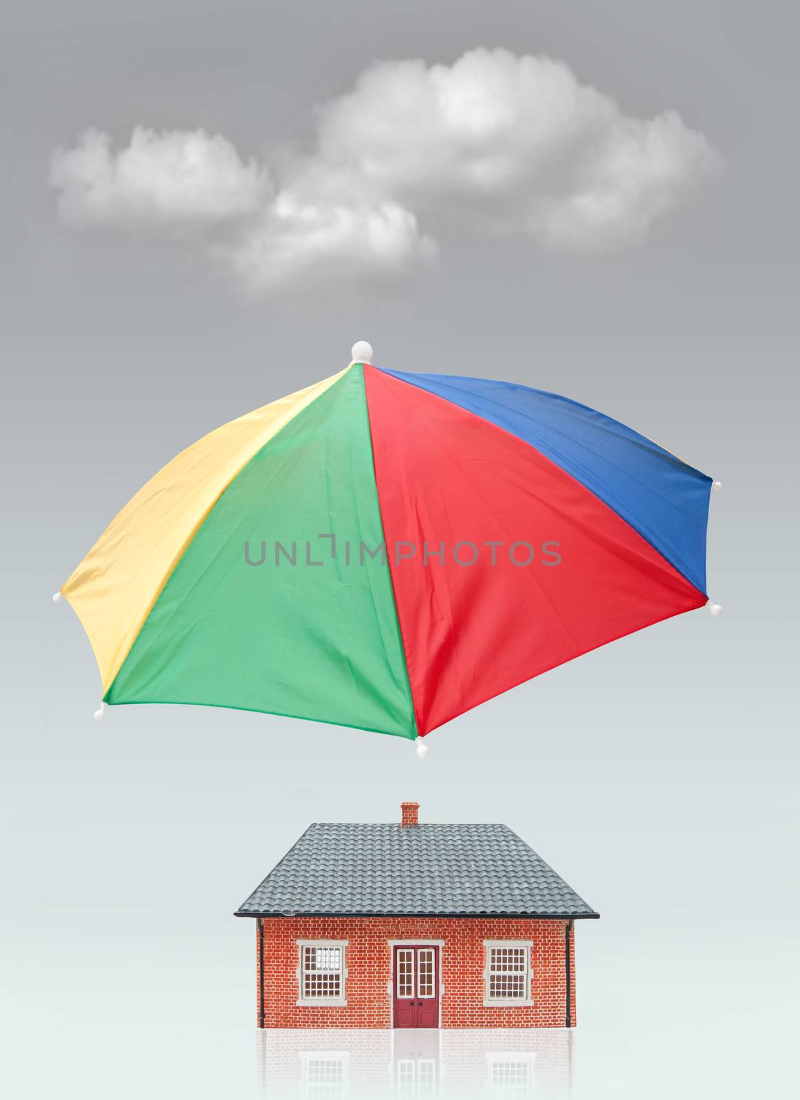 Umbrella shielding a home from a hovering cloud