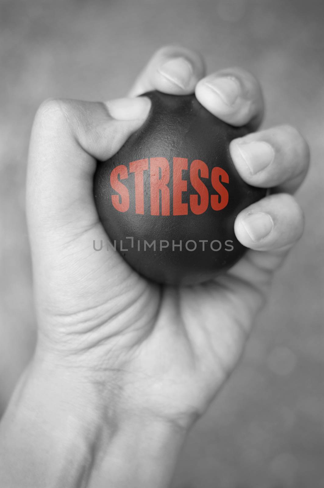 Hand squeezing a stress ball 