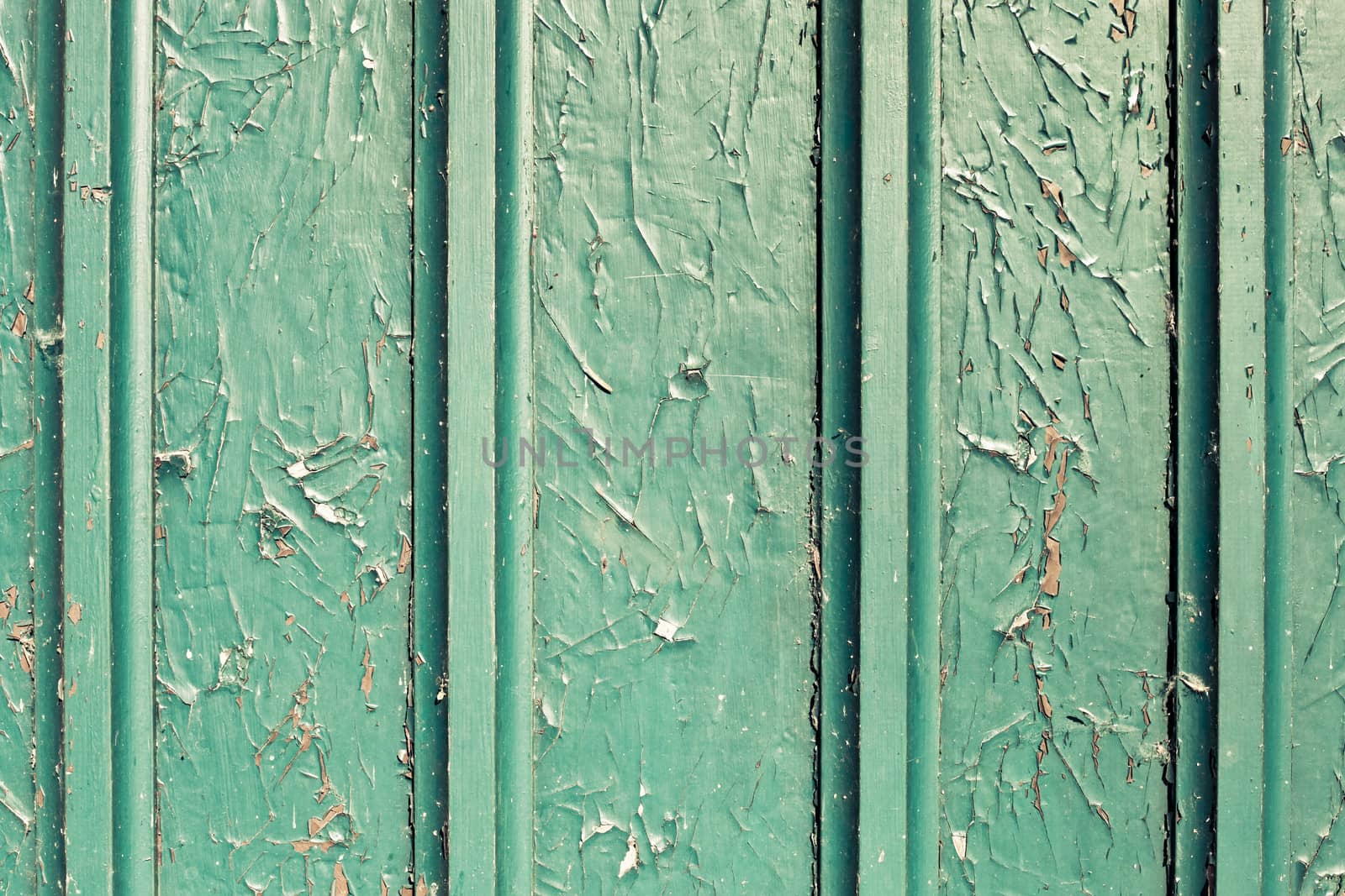 Peeling paint on a wooden surface as a background
