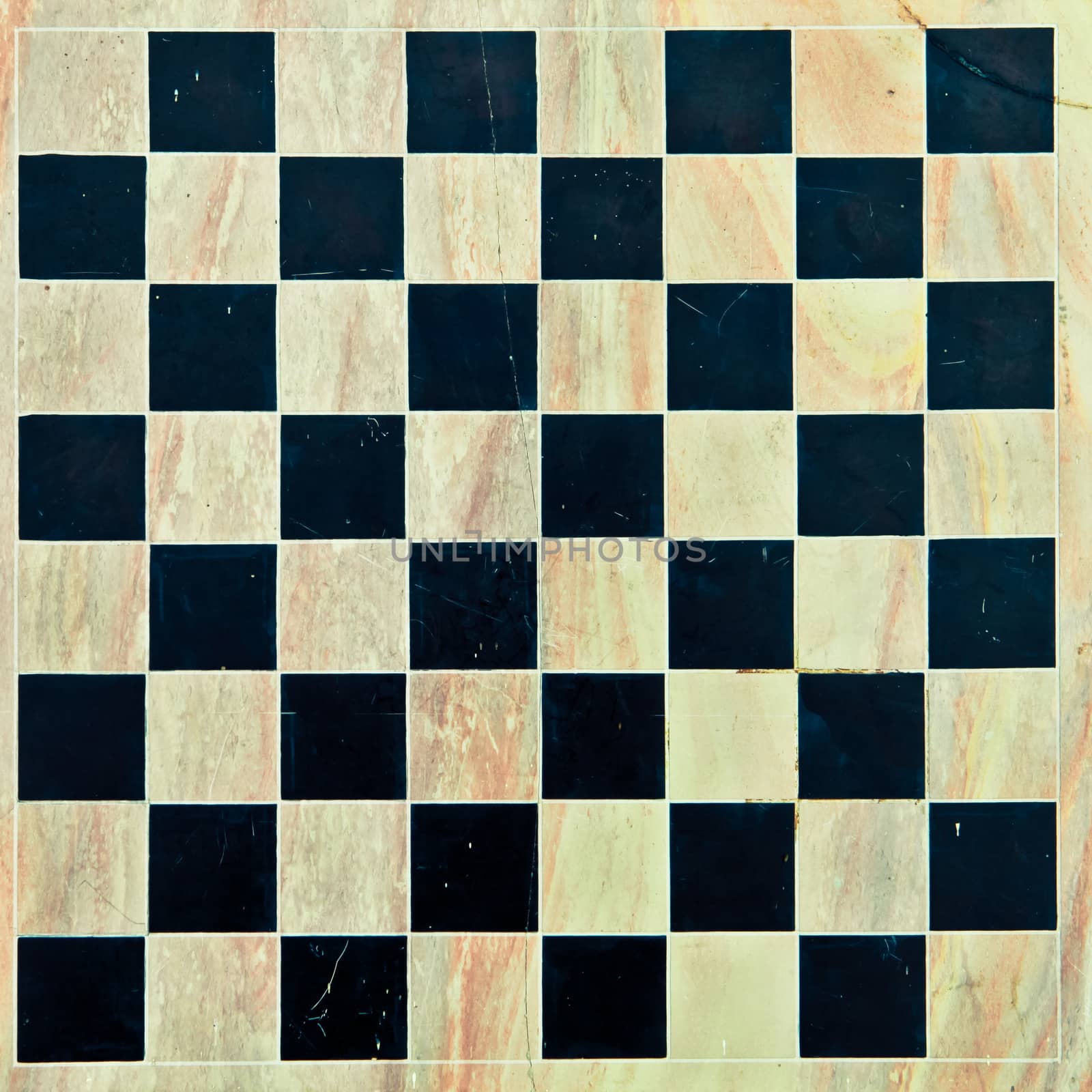 Marble chessboard as a detailed background in subtle vintage tones