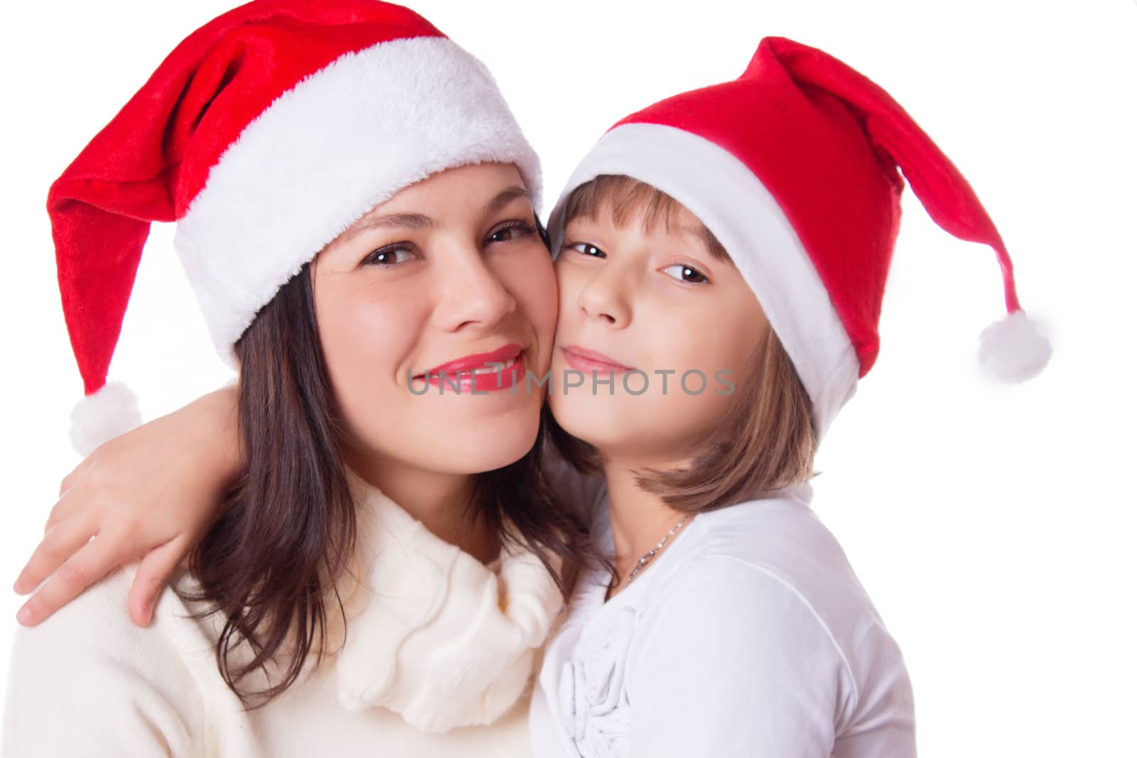 Happy mother and daughter hugging in Christmas hat by Angel_a