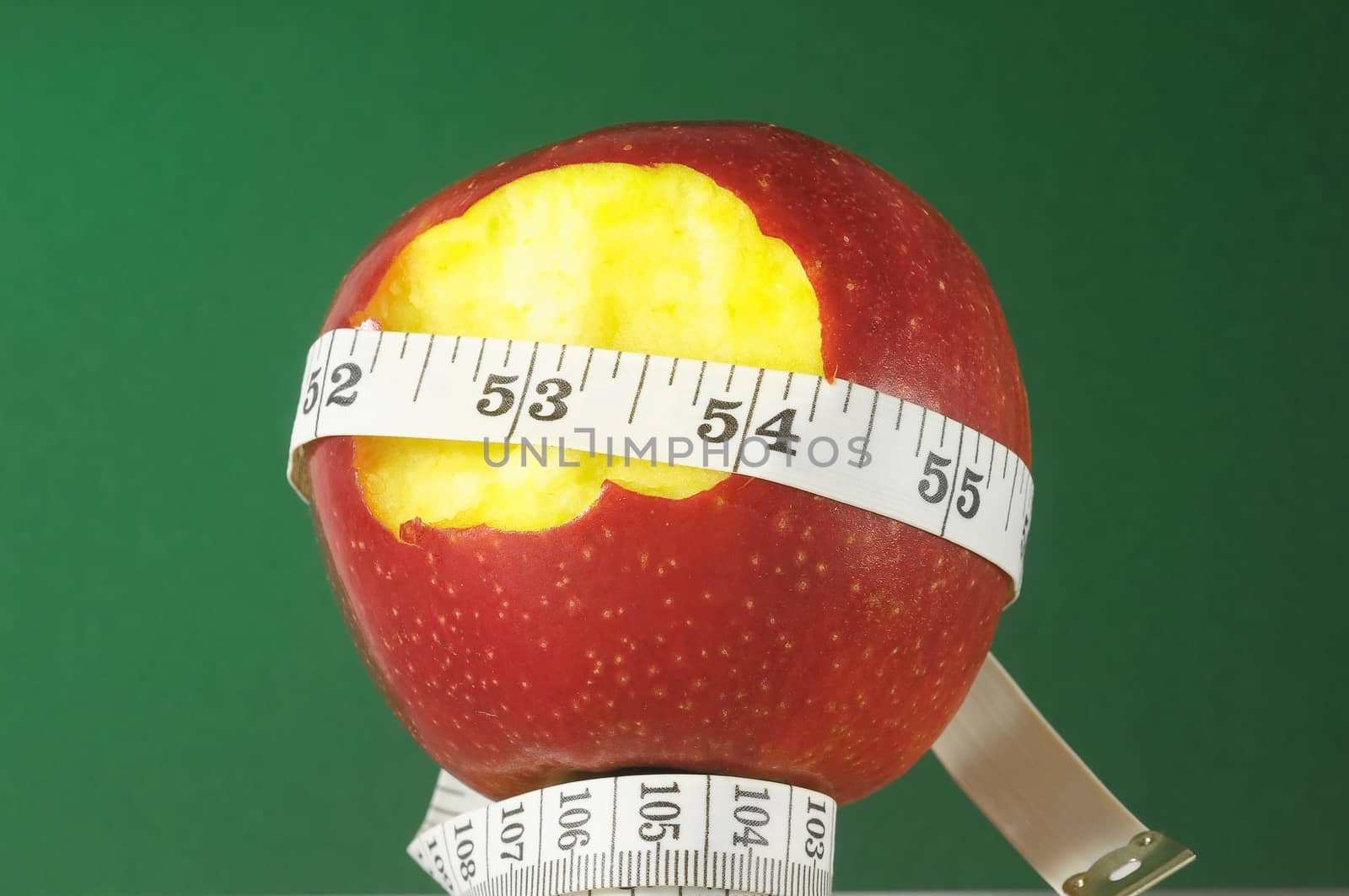 Diet Apple and Meter on a Colored Background 