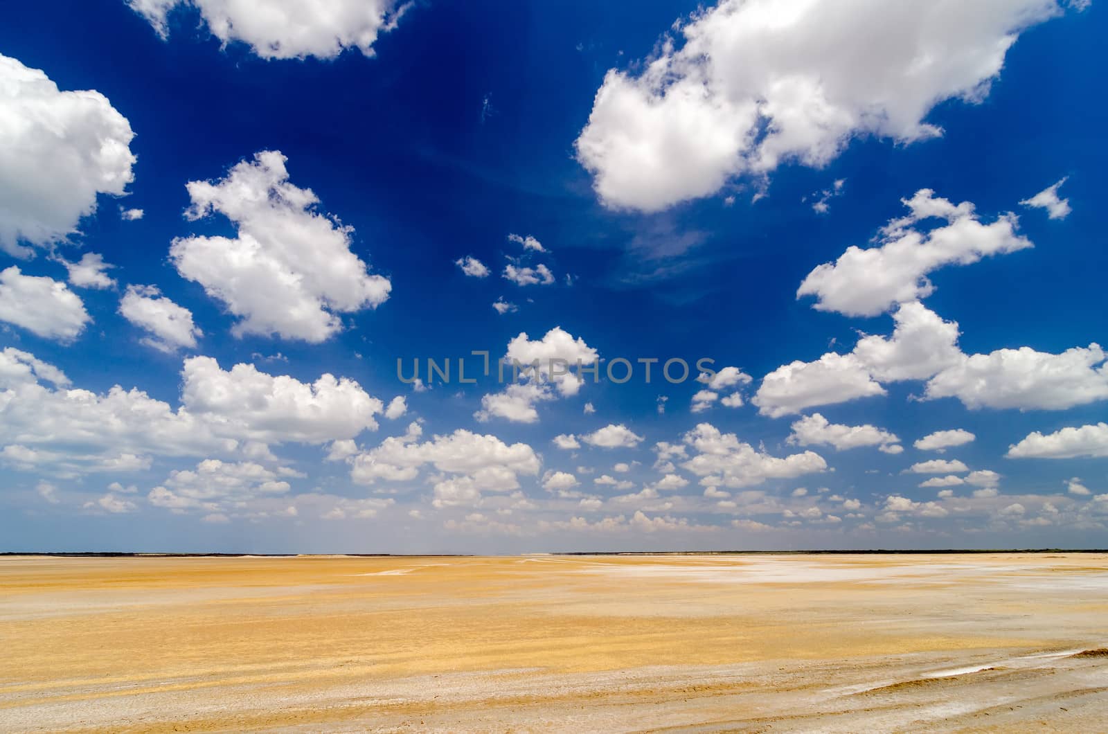Dry desert flatlands with a dramatic blue sky in La Guajira, Colombia