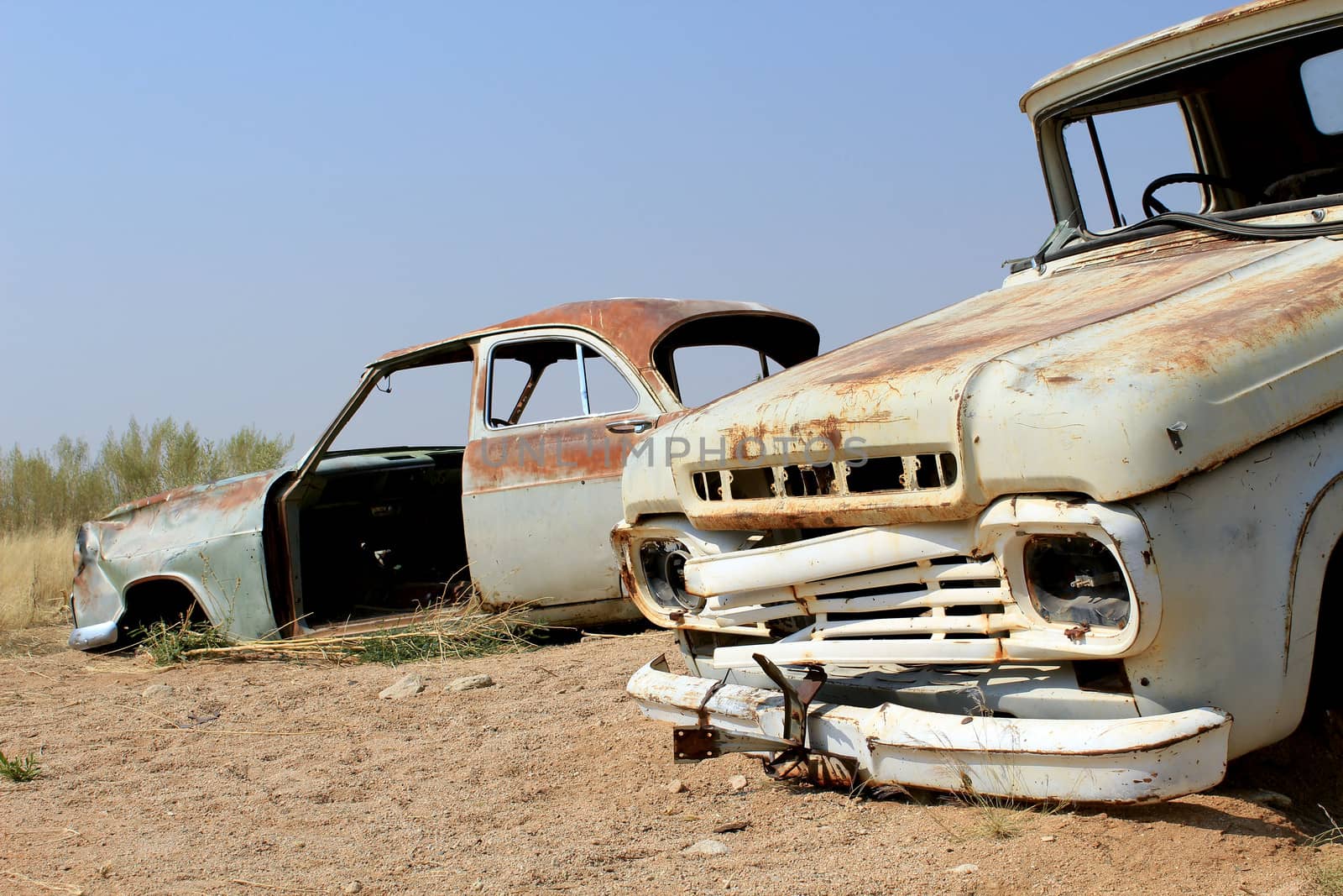 Old and rusty car wreck at the last gaz station before the Namib by ptxgarfield