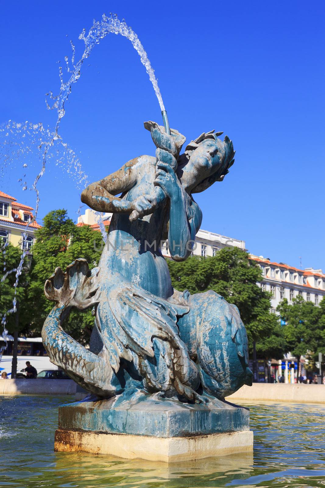 Baroque fountain on rossio square the liveliest placa in Lisbon