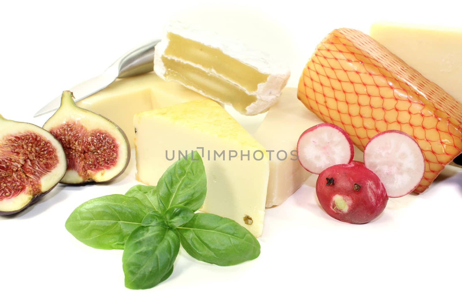 delicious selection of cheese with knife, radishes mouse and fig