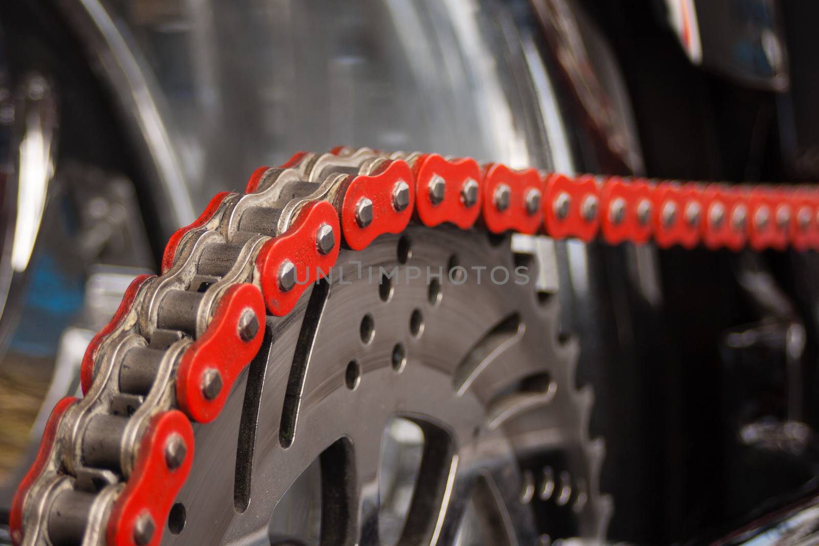 Motorcycle chain and sprocket in detail.