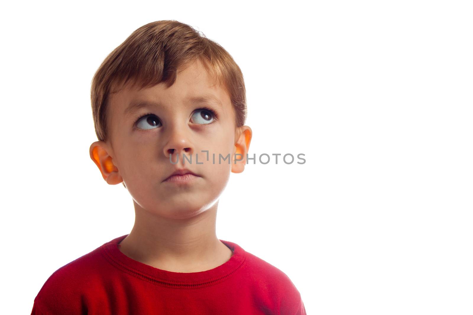 Child thinks while posing for camera