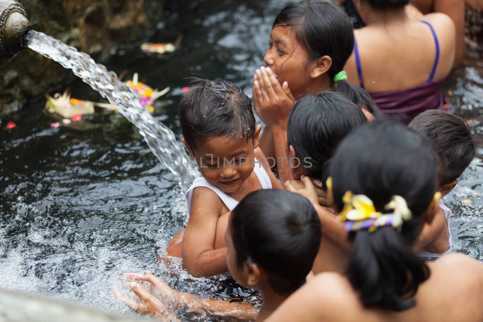 Purification in sacred holy spring water, Bali by iryna_rasko