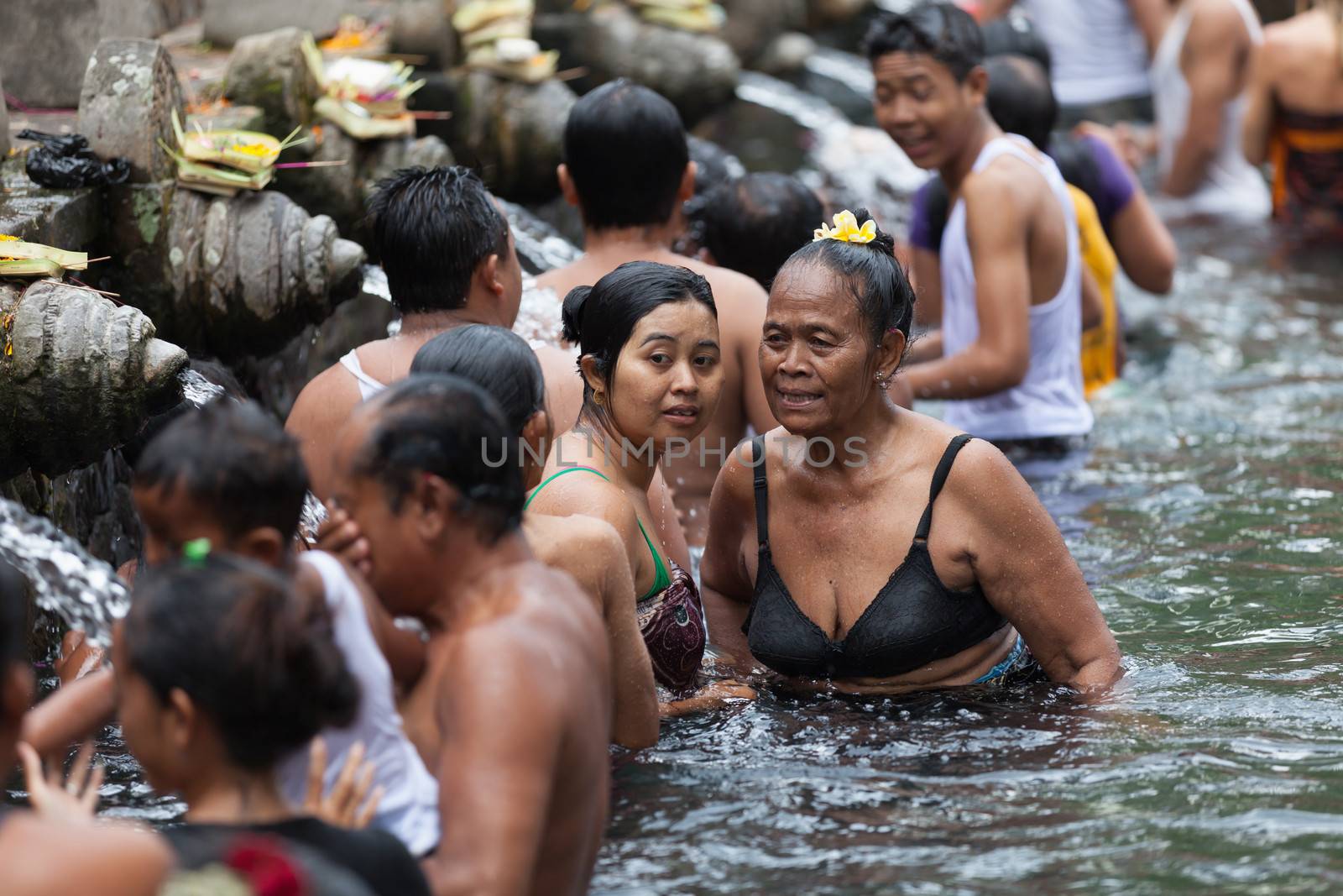 Purification in sacred holy spring water, Bali by iryna_rasko