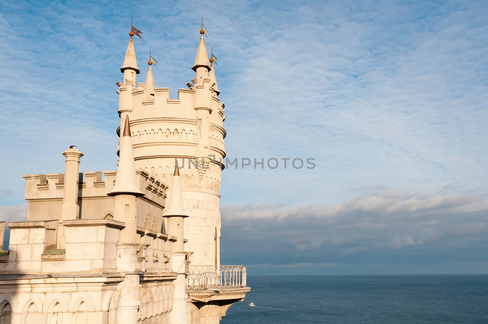 Swallow's Nest Castle tower, Crimea, Ukraine, with blue sky and sea on background