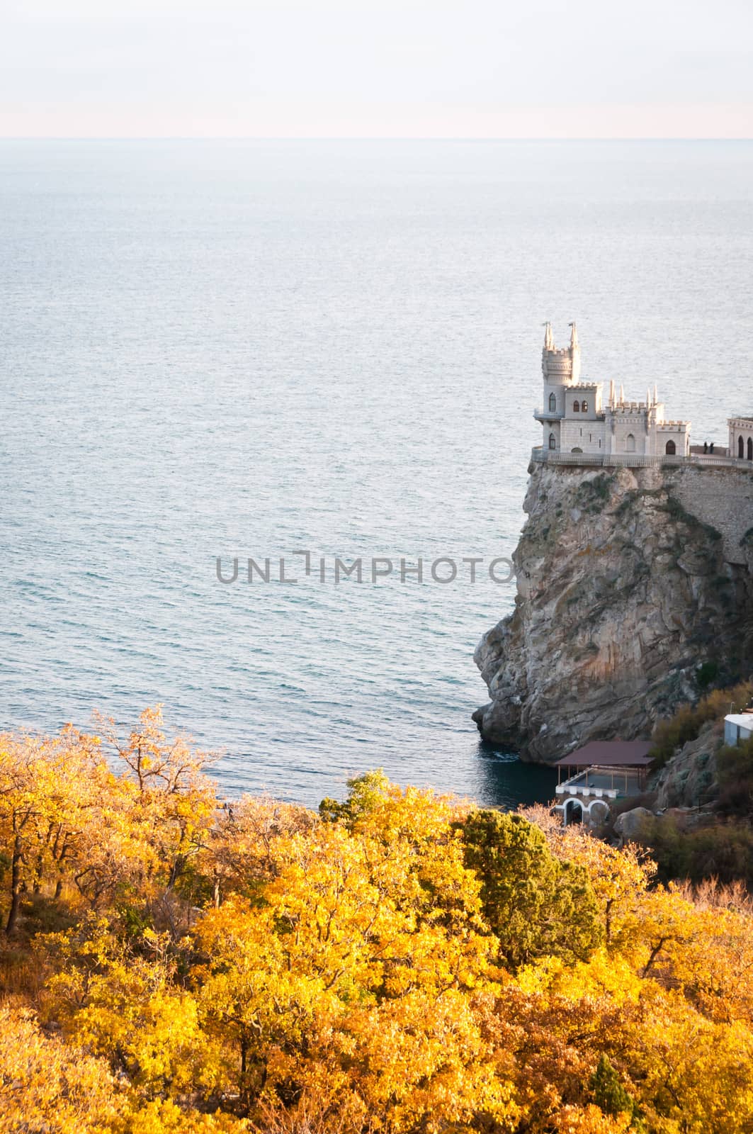 Swallow's Nest, crimea, Ukraine with autumnal trees on front