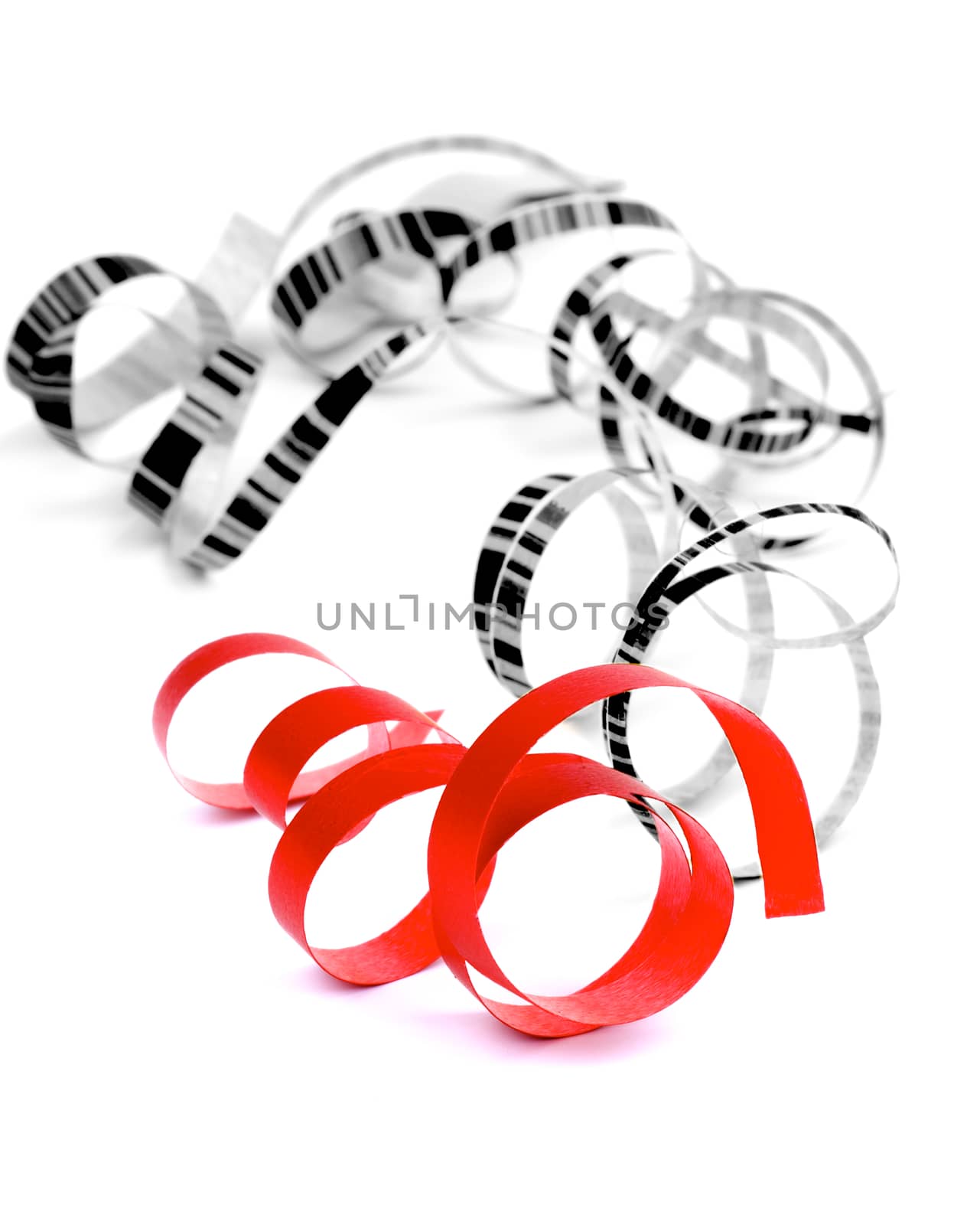 Curly Party Streamers Red and Striped Monochrome Lying on white background