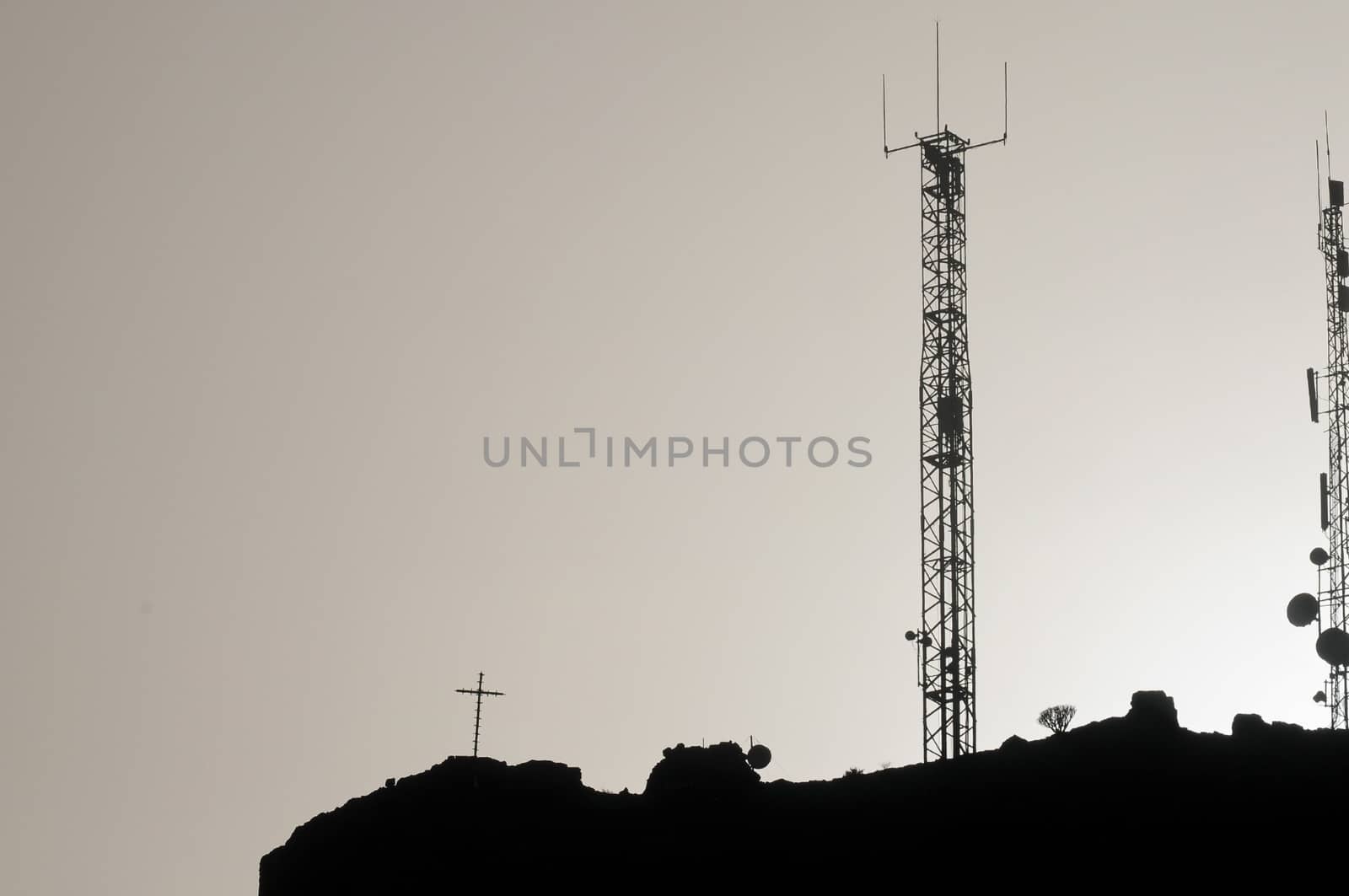 Some Silhouetted Antennas on the top of a Hill