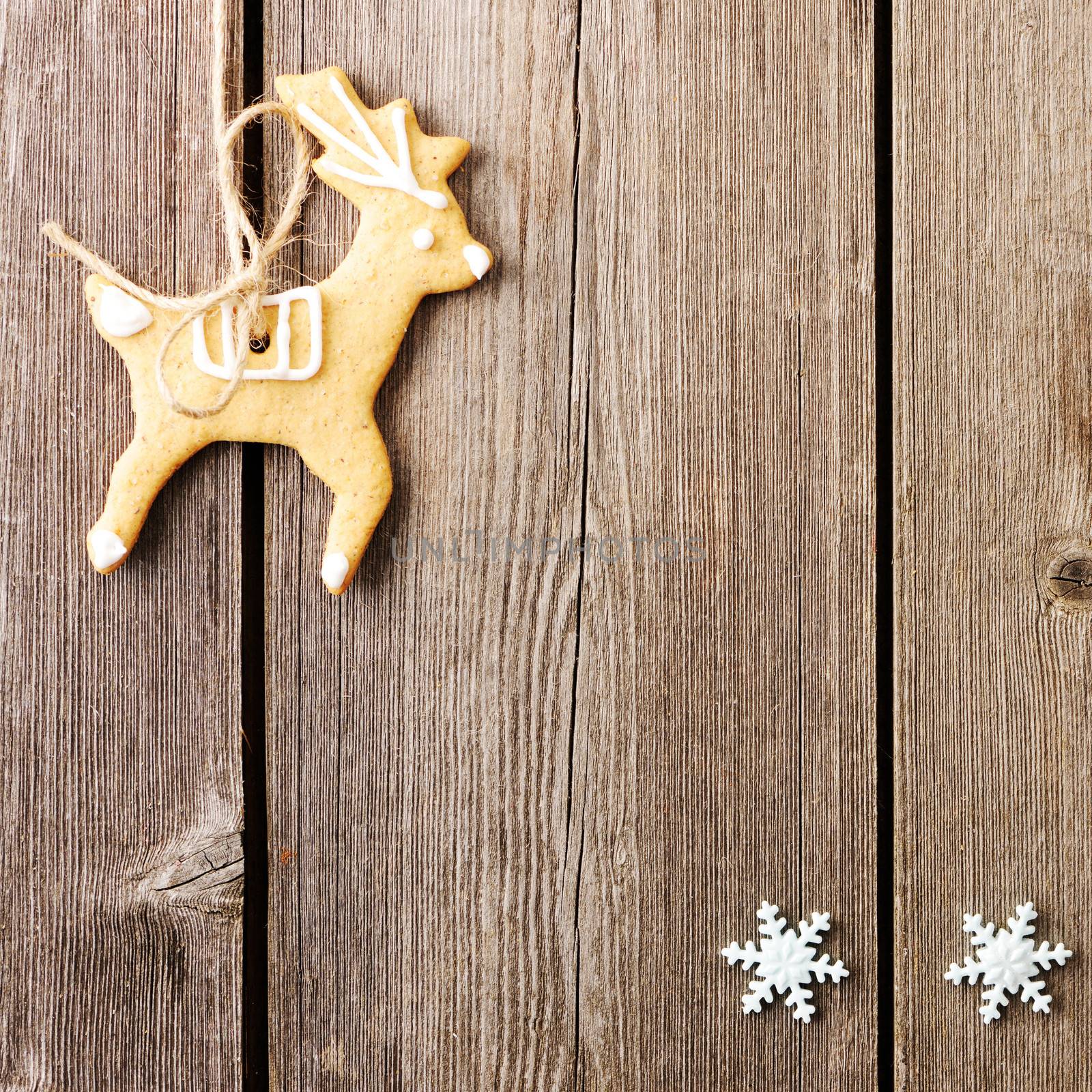 Christmas homemade gingerbread cookies over wooden table